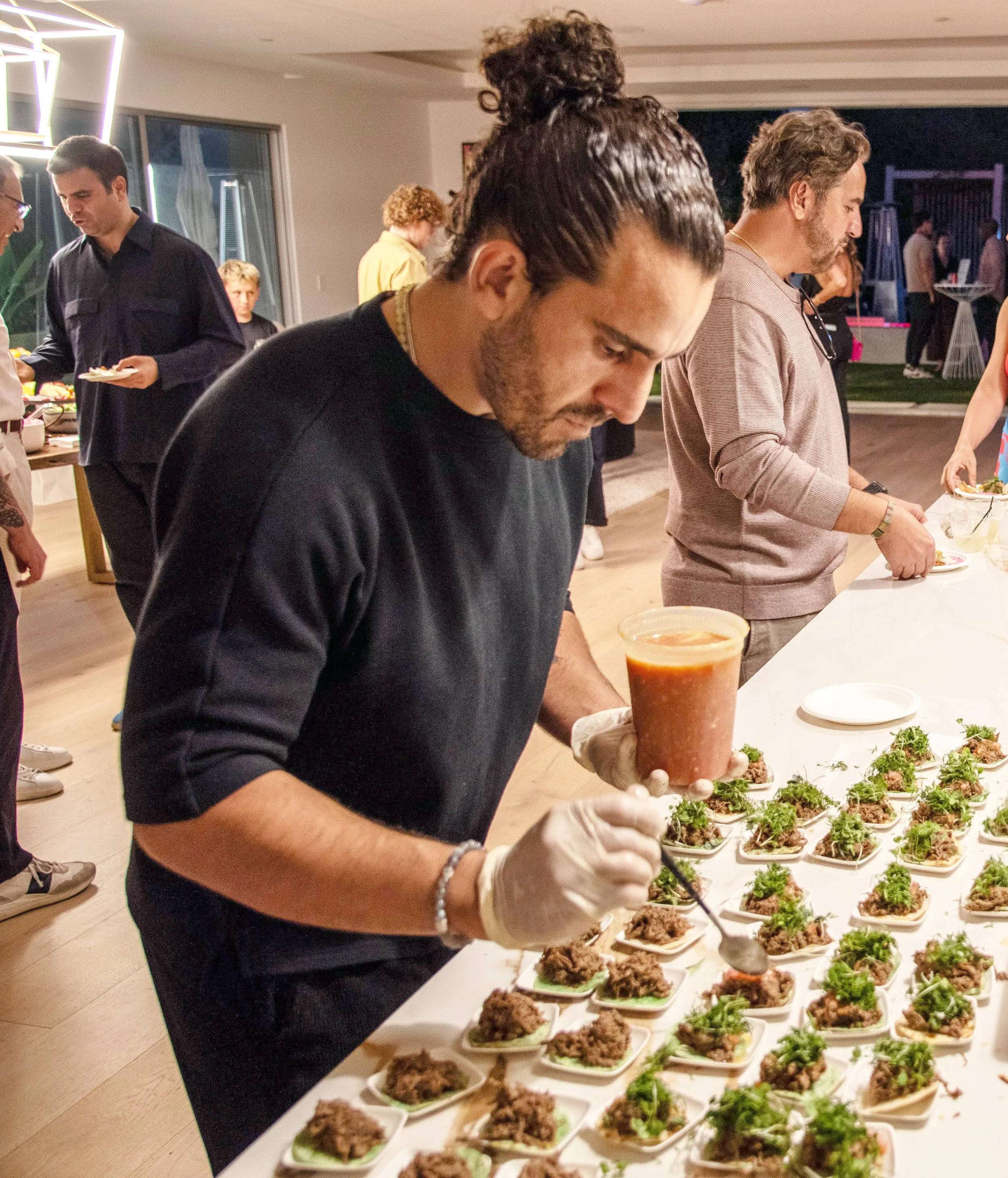 Chef Piaz and team plating small bites for a catered event in Los Angeles