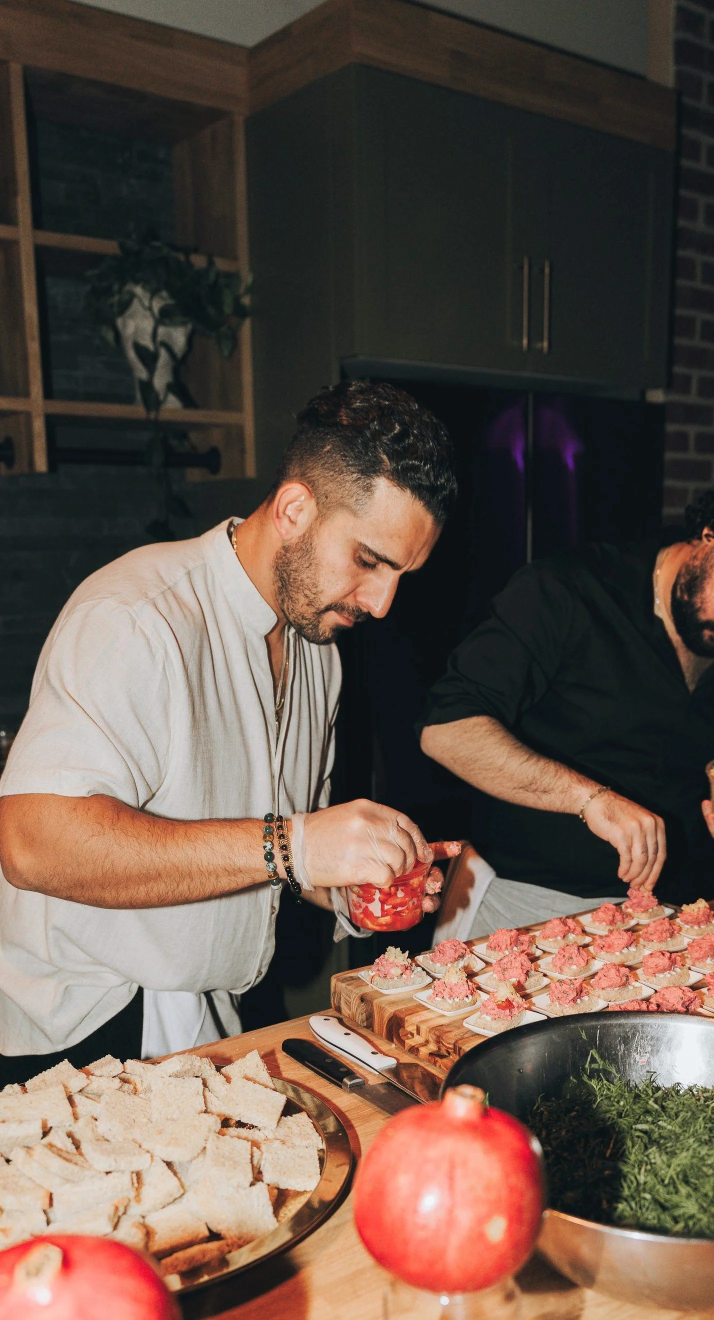 Chef Piaz and a fellow chef preparing preparing and plating at a youtube event in Vancouver Canada. Corporate event in Vancouver