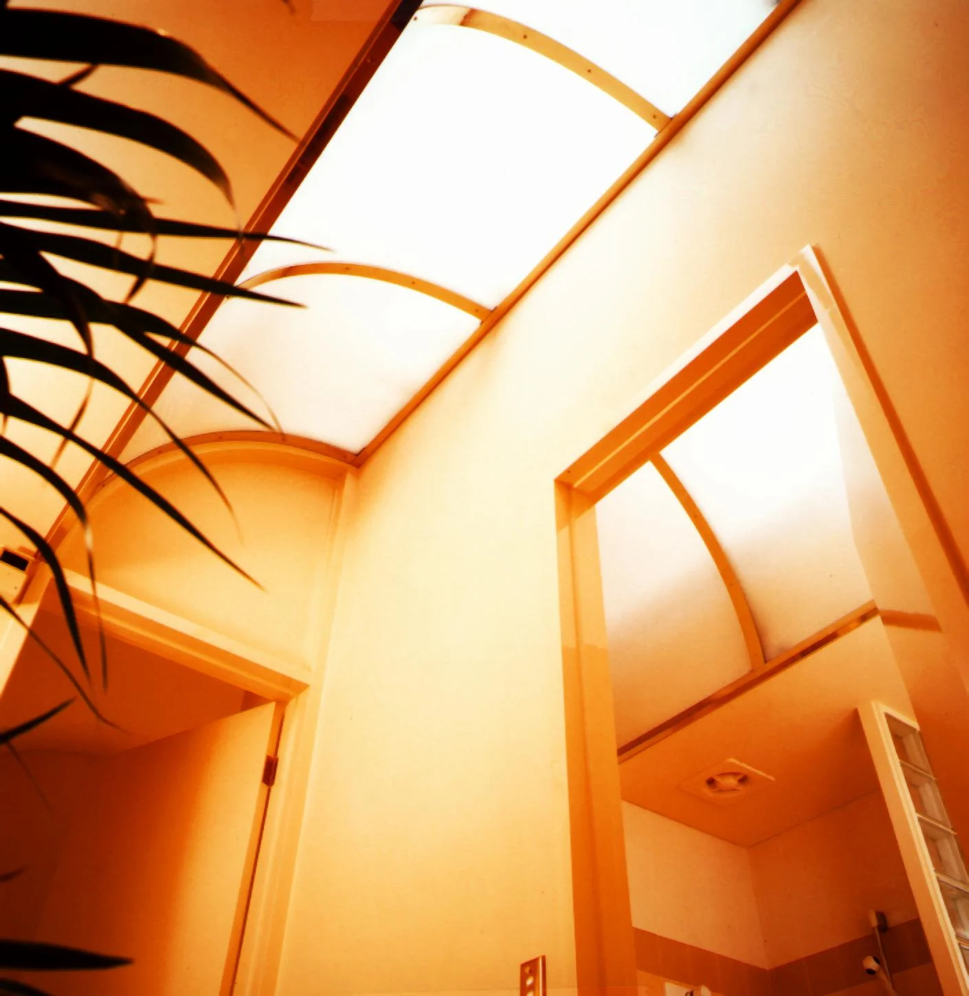Curved skylight over an arched doorway