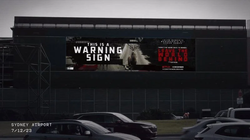 Billboard at Sydney Airport: This is a warning sign