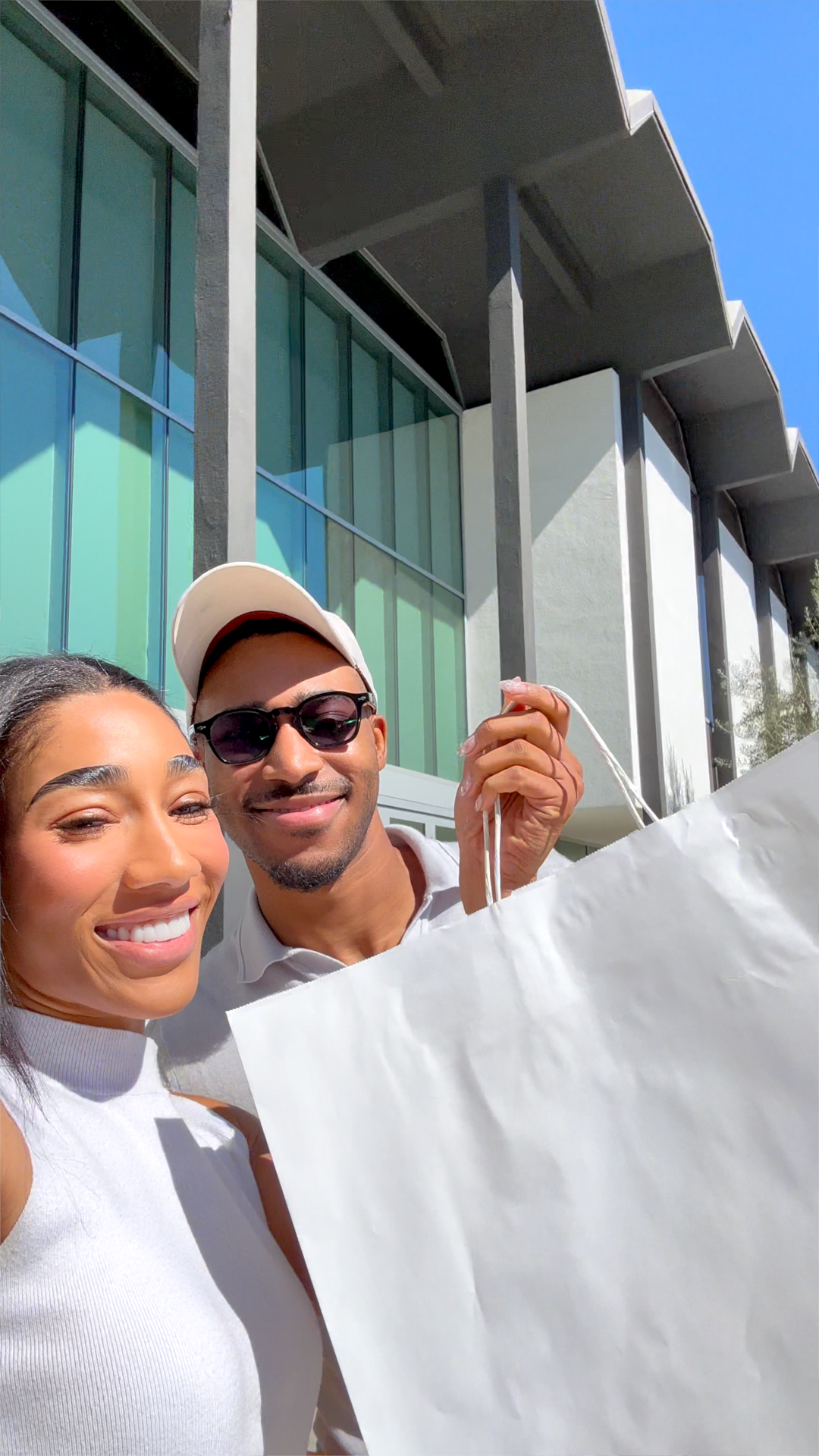Christian Chanel and her brother holding their Hermès shopping bags after the Hermès private sale in Los Angeles