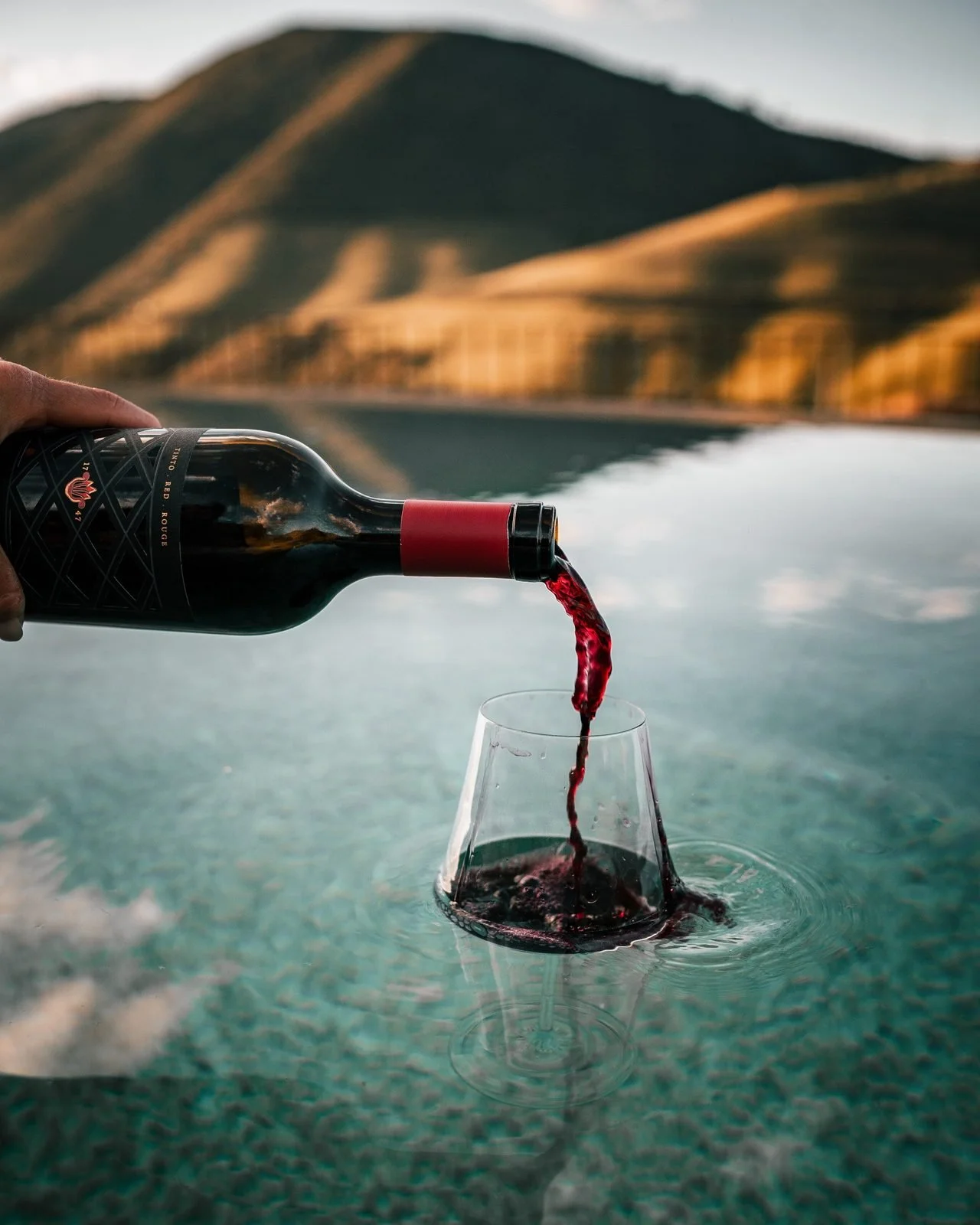 pouring red wine in a glass