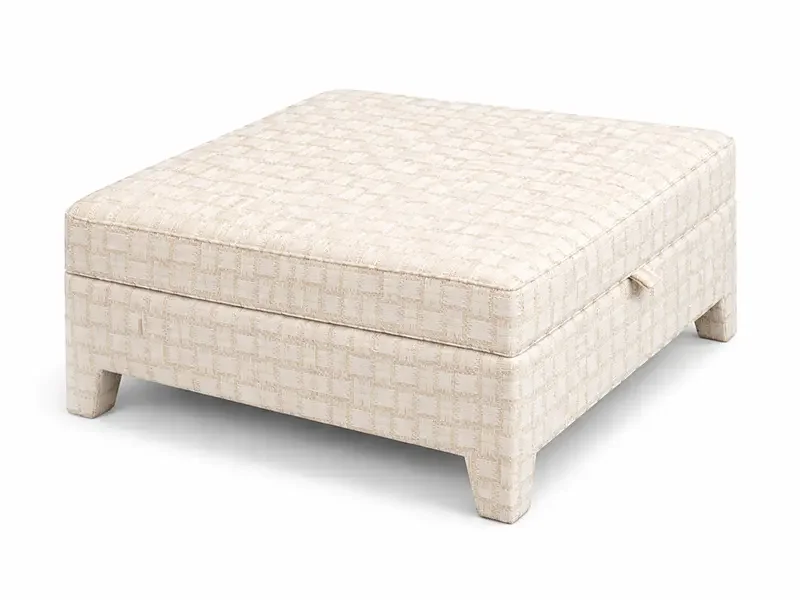 Beige upholstered square ottoman with a textured pattern, resting on short legs.