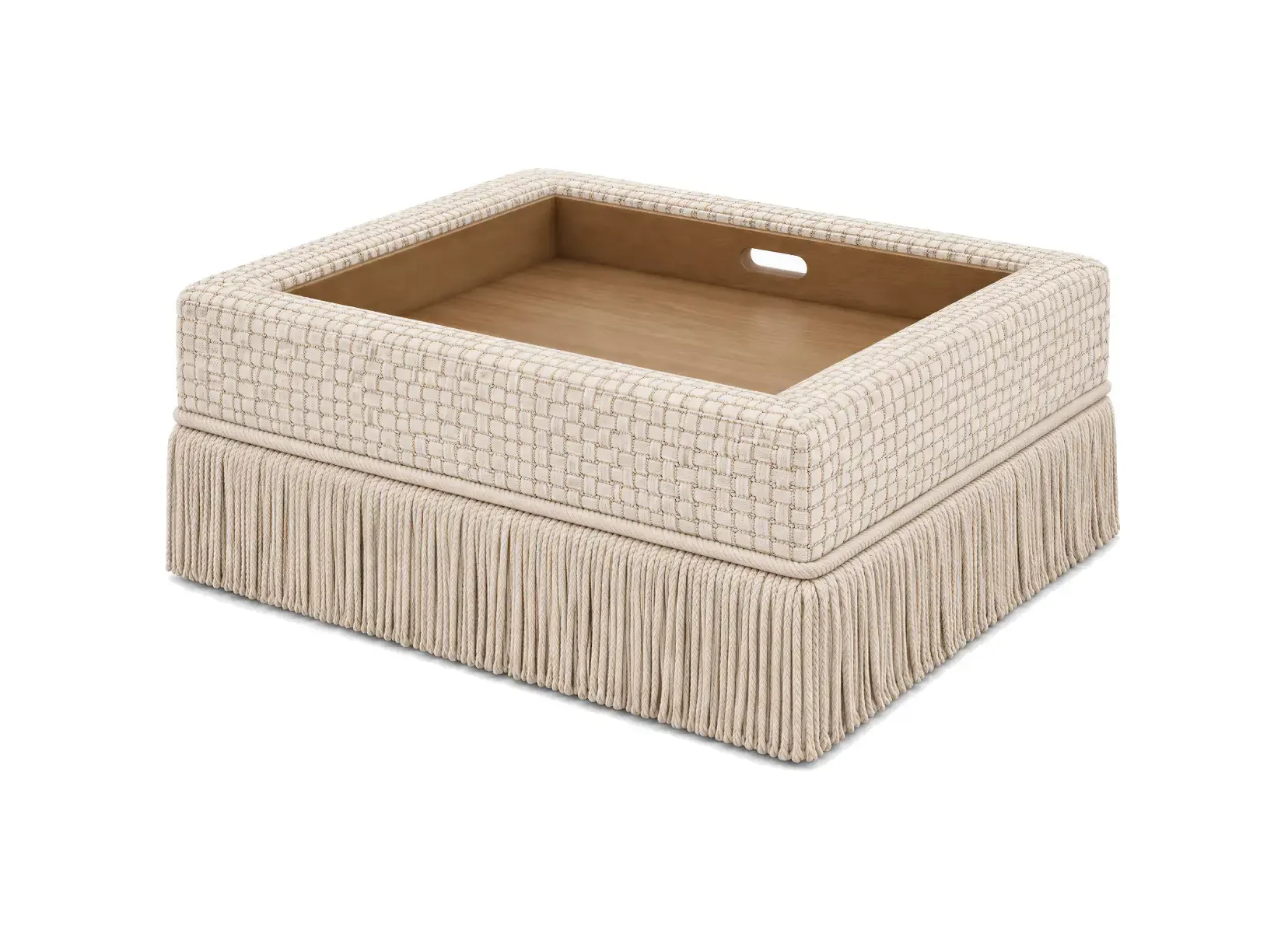 A upholstered stool with a cushioned top, open center, and fringed skirt in beige fabric.