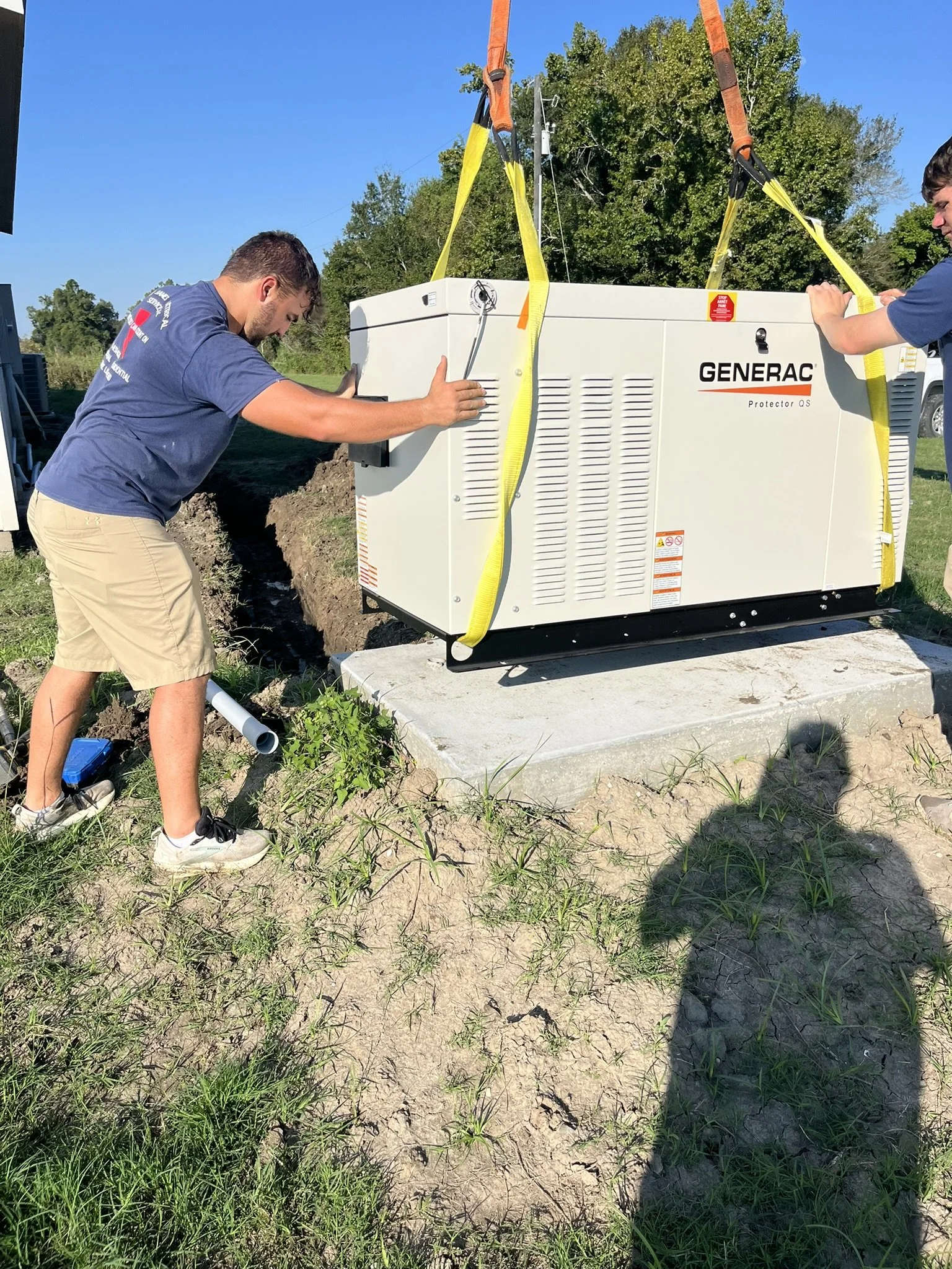 Tony James Electrical crew setting a Generac standby generator in South Louisiana