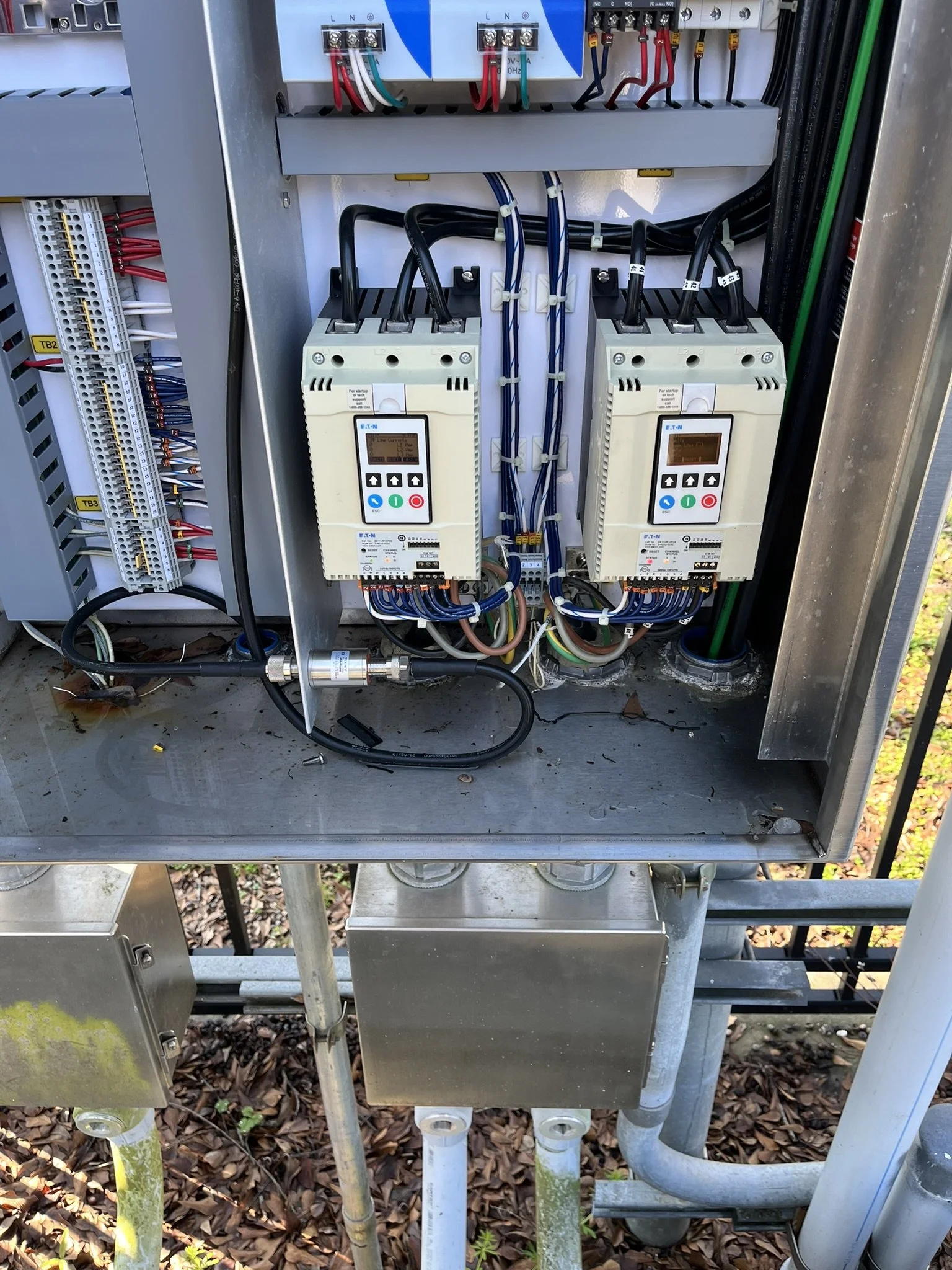 Commercial motor control panel with soft starters wired by Tony James Electrical
