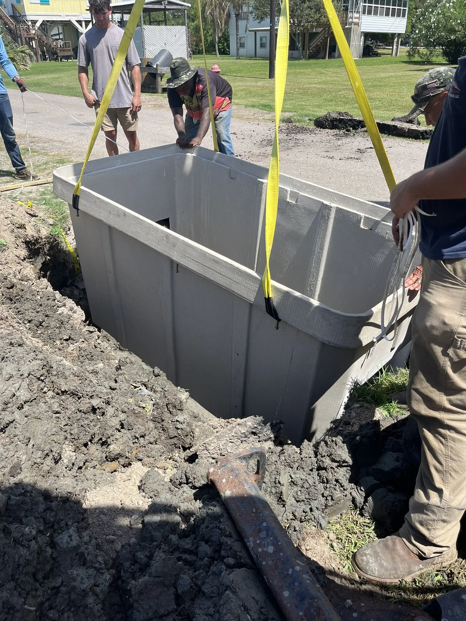 Tony James Electrical crew setting an underground electrical vault