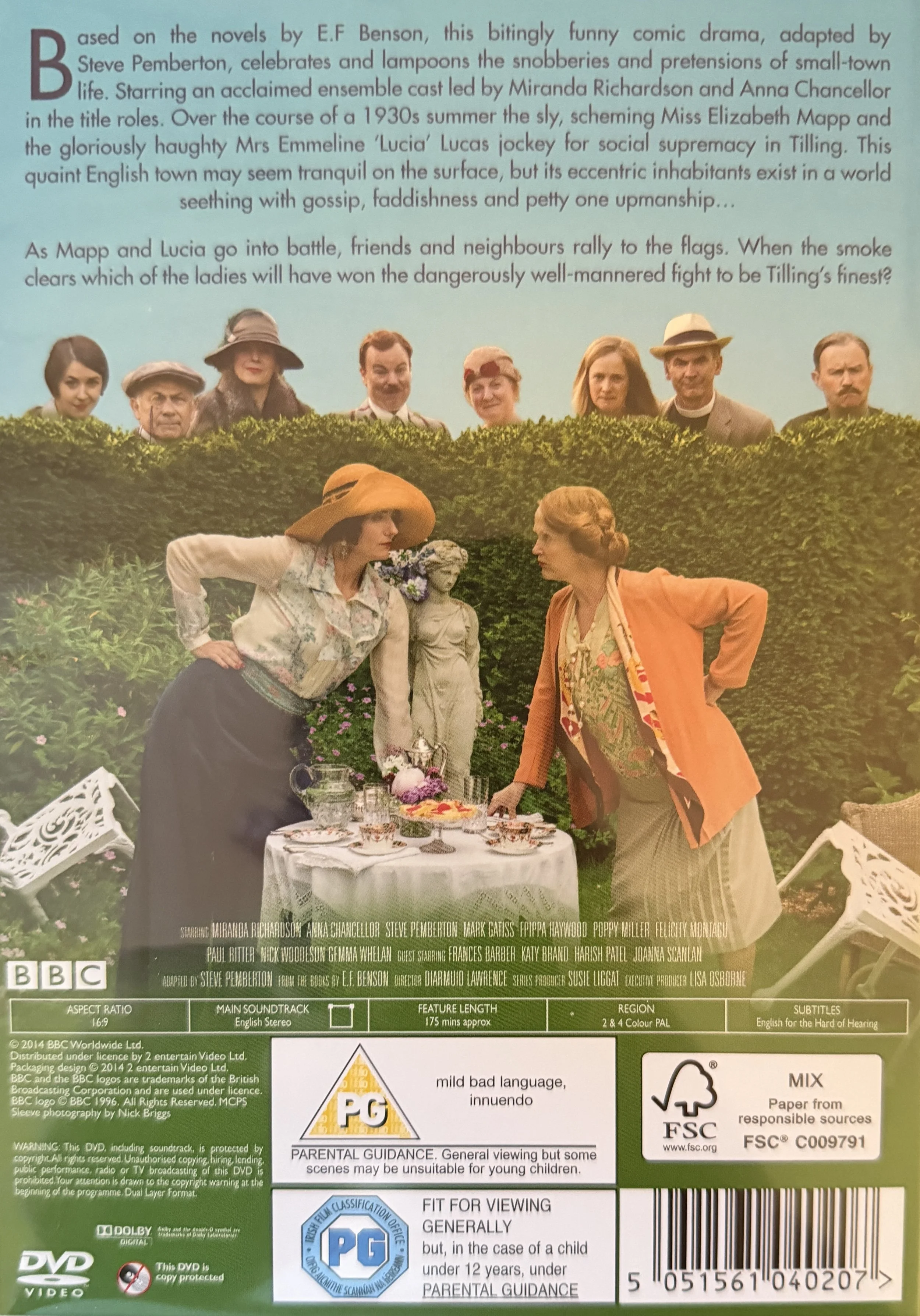 DVD back cover for "Mapp and Lucia"featuring women dressed in vintage clothing and hats, gathered around a table with a white tablecloth, an ornate teapot, cups, and a statue outdoors with a hedge and portraits of men and women in the background.