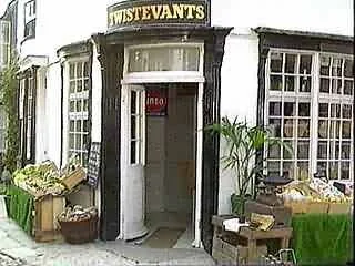 Exterior of a store called Twistevents with open door and boxes of items outside