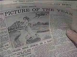 A person holding a newspaper with a headline about a picture of the year, featuring a winter scene with a frozen men's ordeal on a raft.