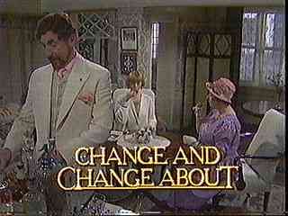 Scene from a movie or TV show with three people in an indoor setting, one man in a white suit, two women, one wearing a hat, and the text 'Change and Change About' on the screen.
