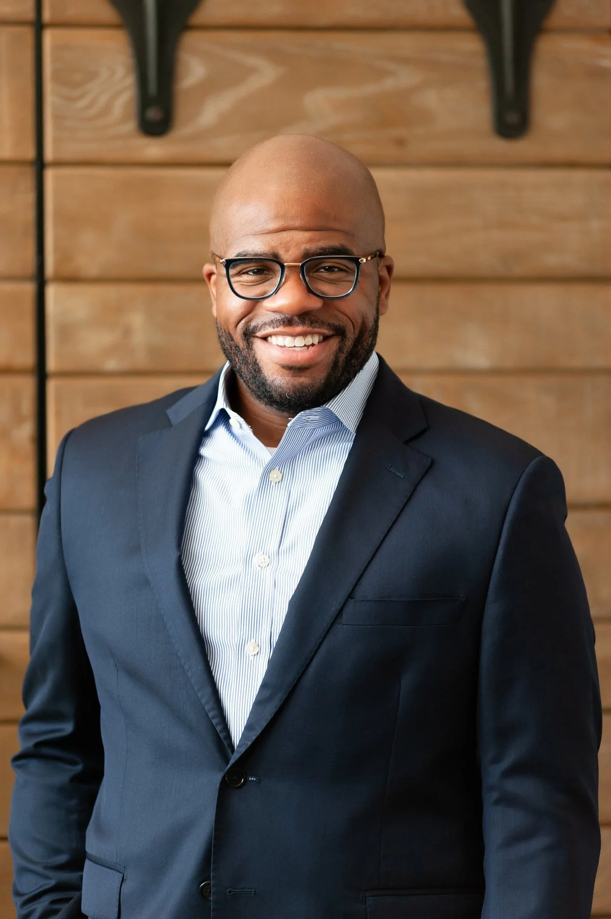 Watson Jones III, Ph.D., smiling in a navy suit