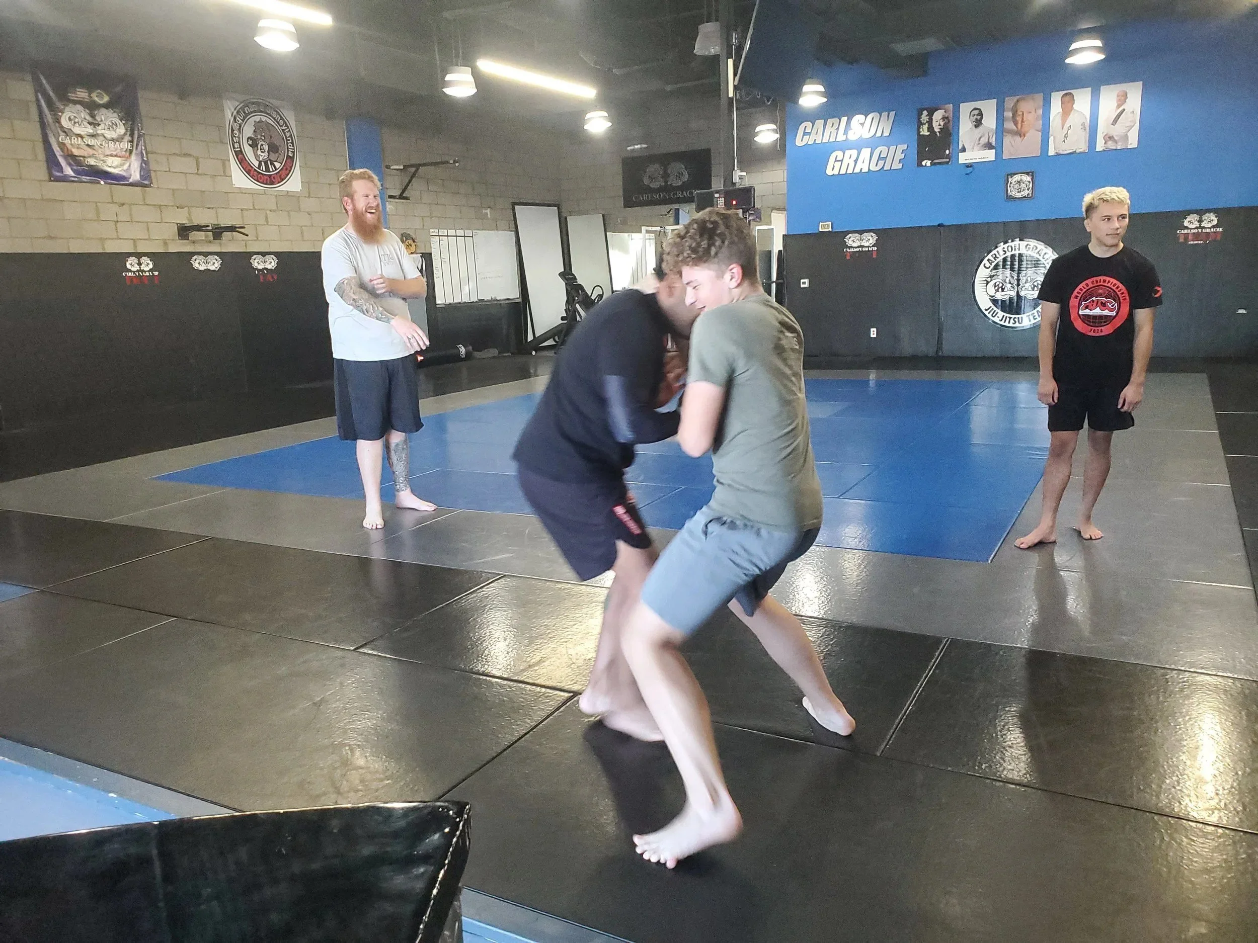 Men's Ministry members learning grappling techniques at a martial arts gym