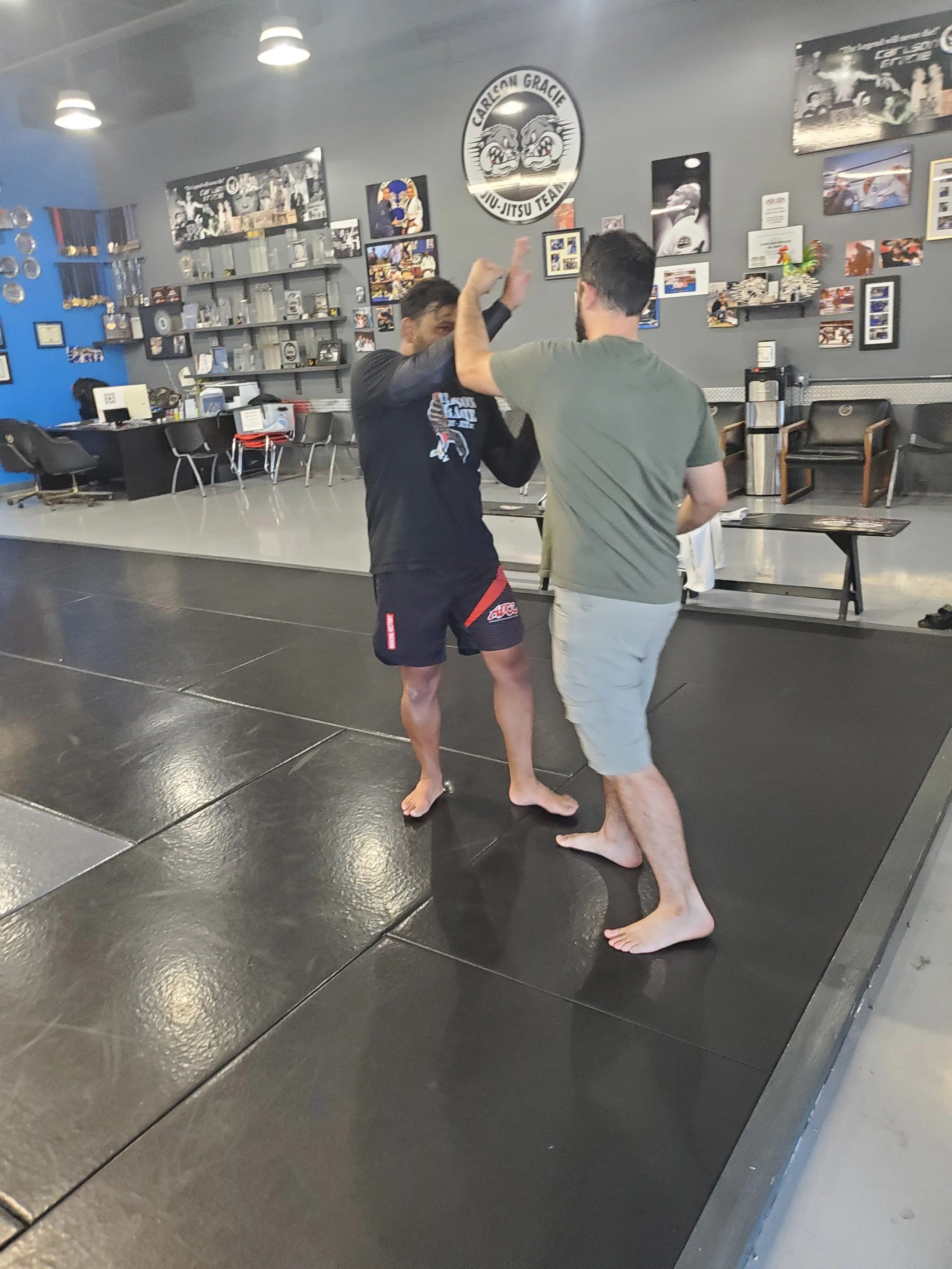 Men's Ministry members learning grappling techniques at a martial arts gym