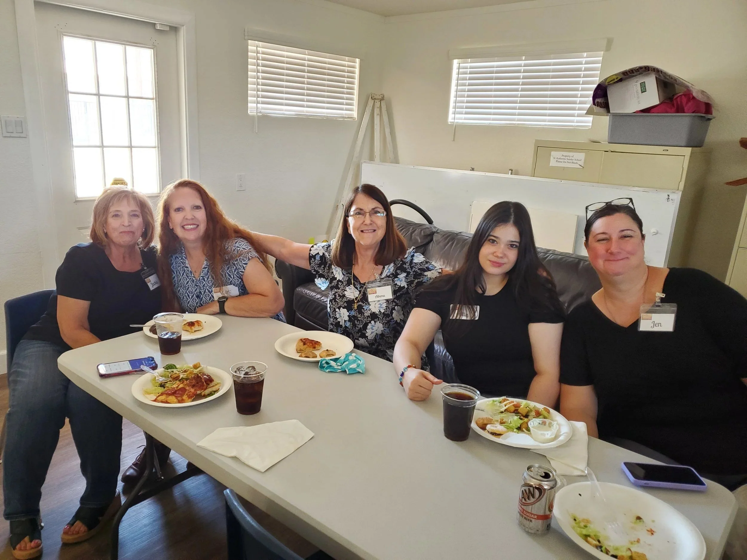 Women's Ministry members seated at a long table at lunch