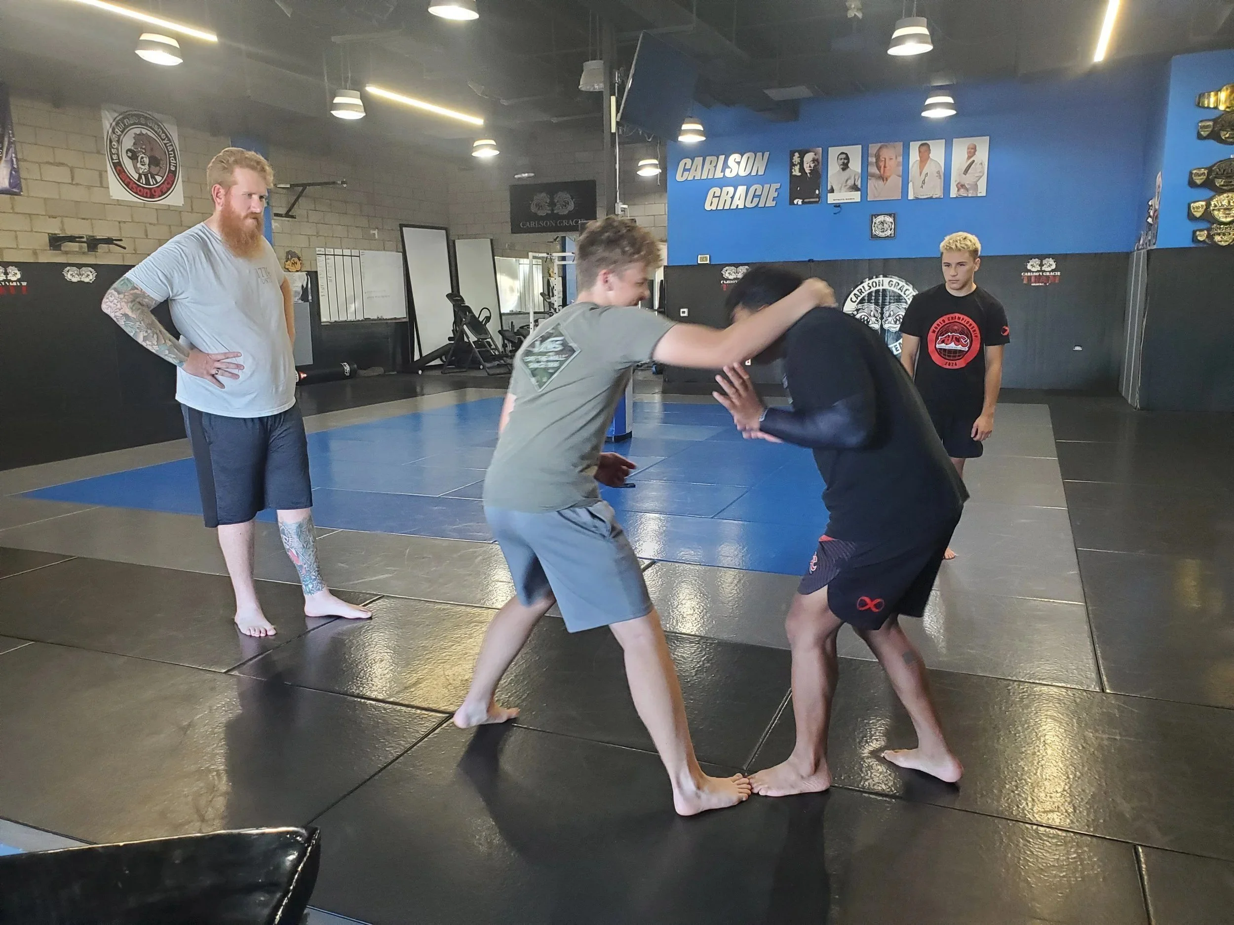Men's Ministry members learning grappling techniques at a martial arts gym
