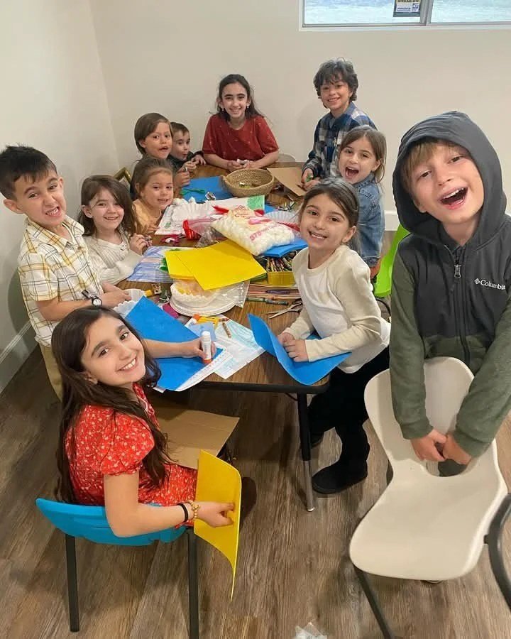 Children doing crafts at a table