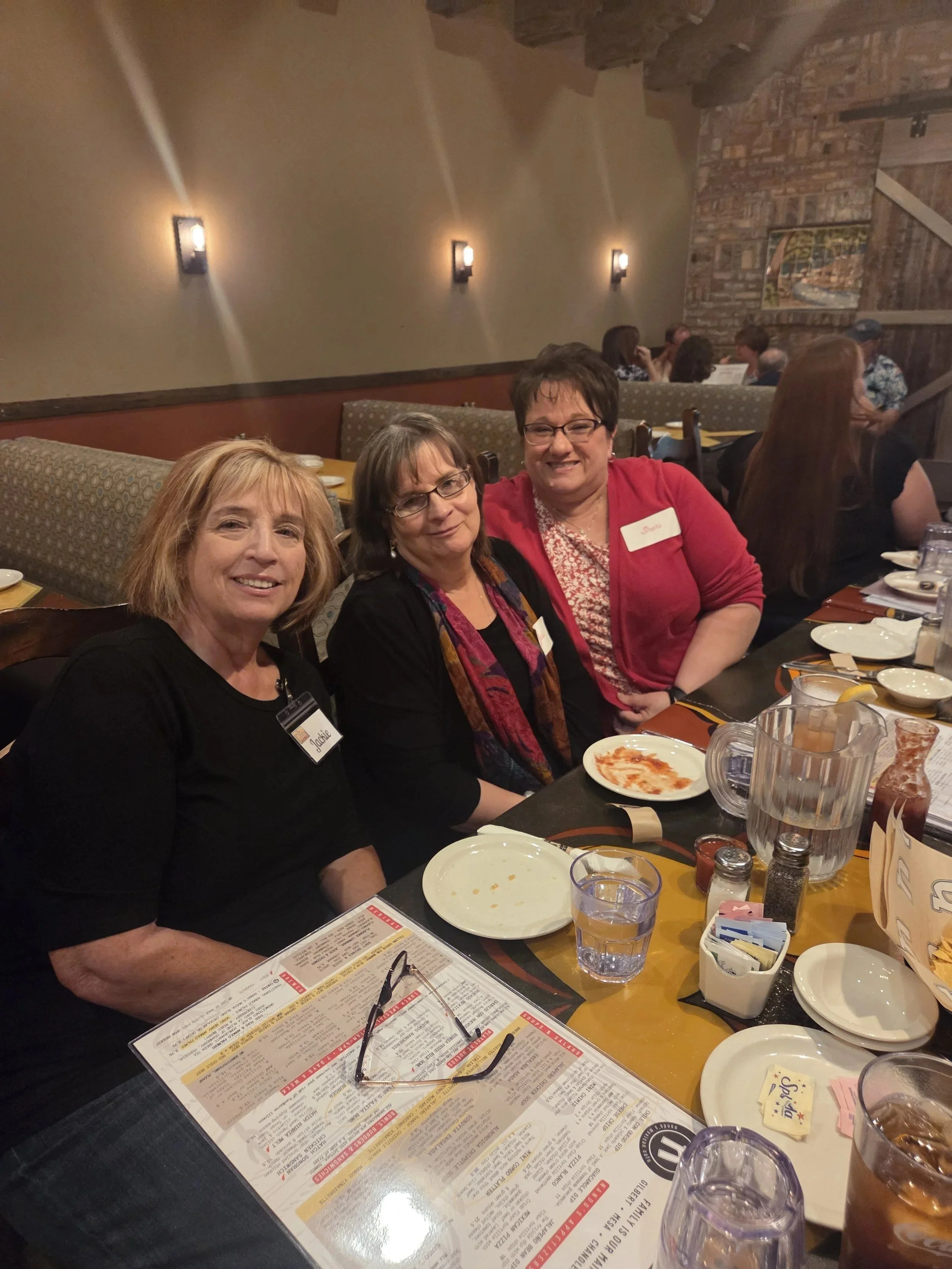 Small group of Women's Ministry members smiling at lunch