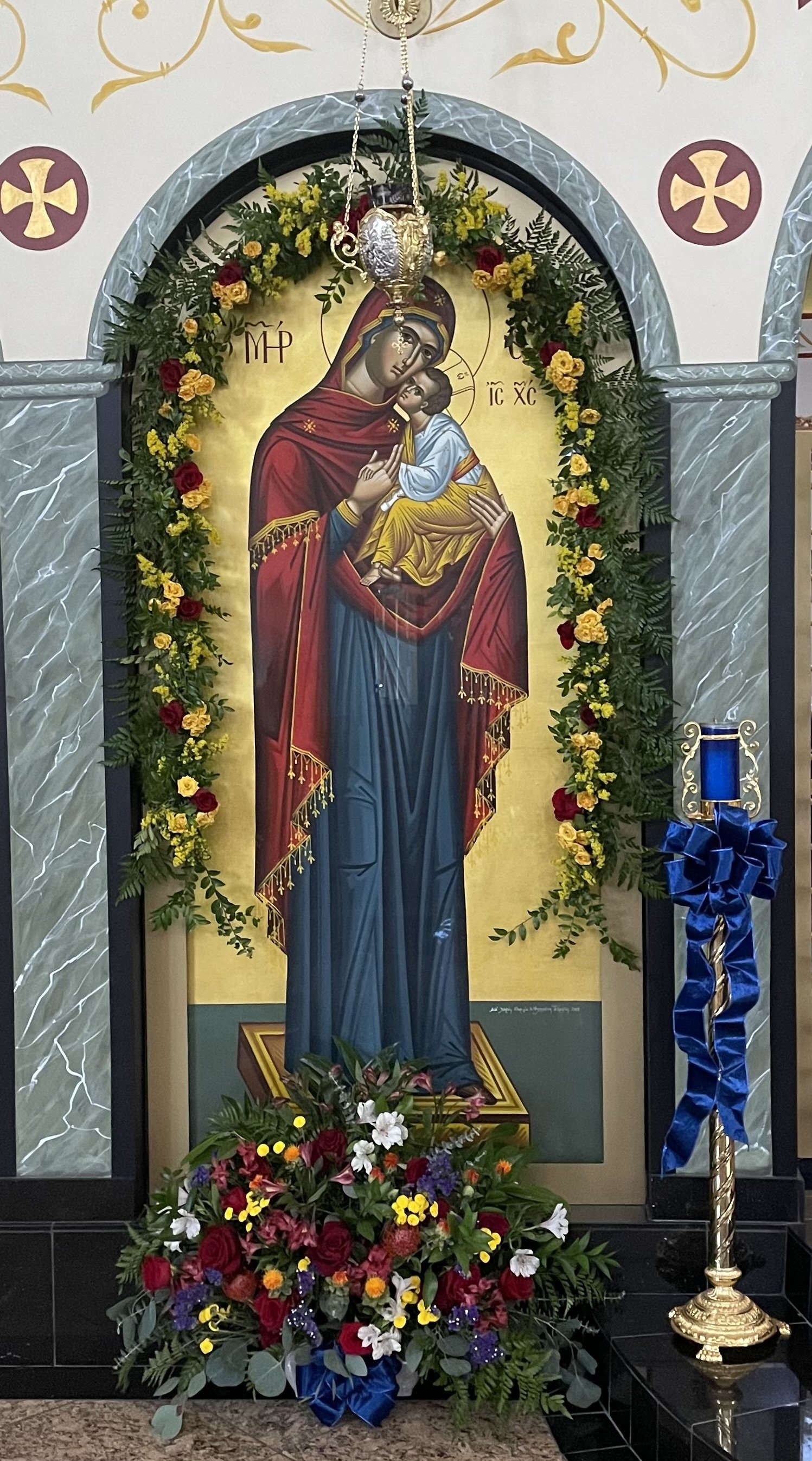 Icon of the Virgin and Child in an arch framed with a flower garland
