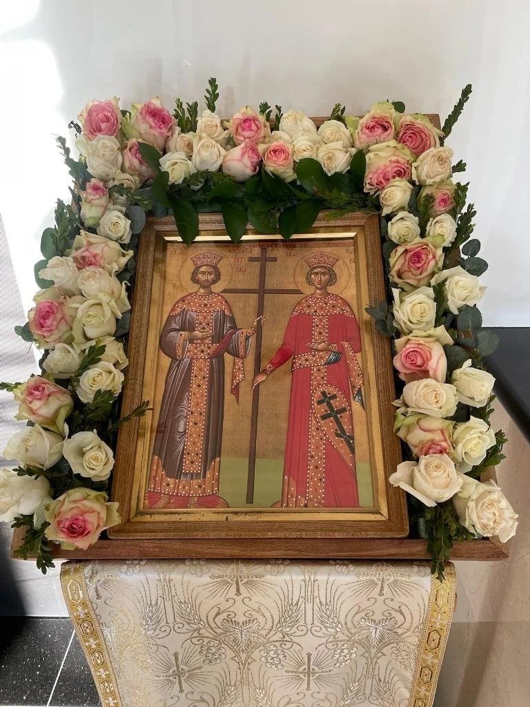 Icon of Saints Constantine and Helen framed with pink and white roses