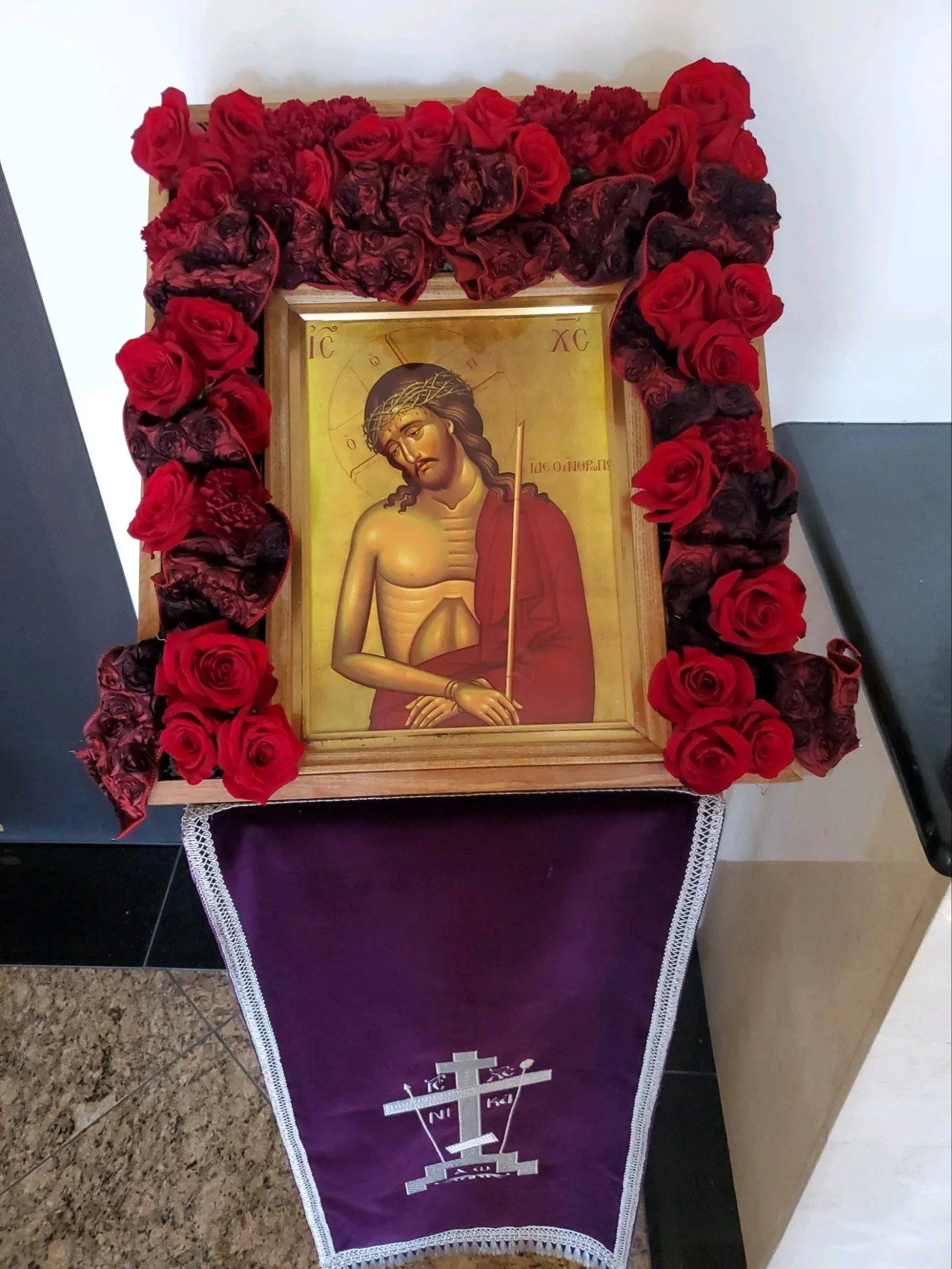 Icon of Christ the Bridegroom framed with red roses