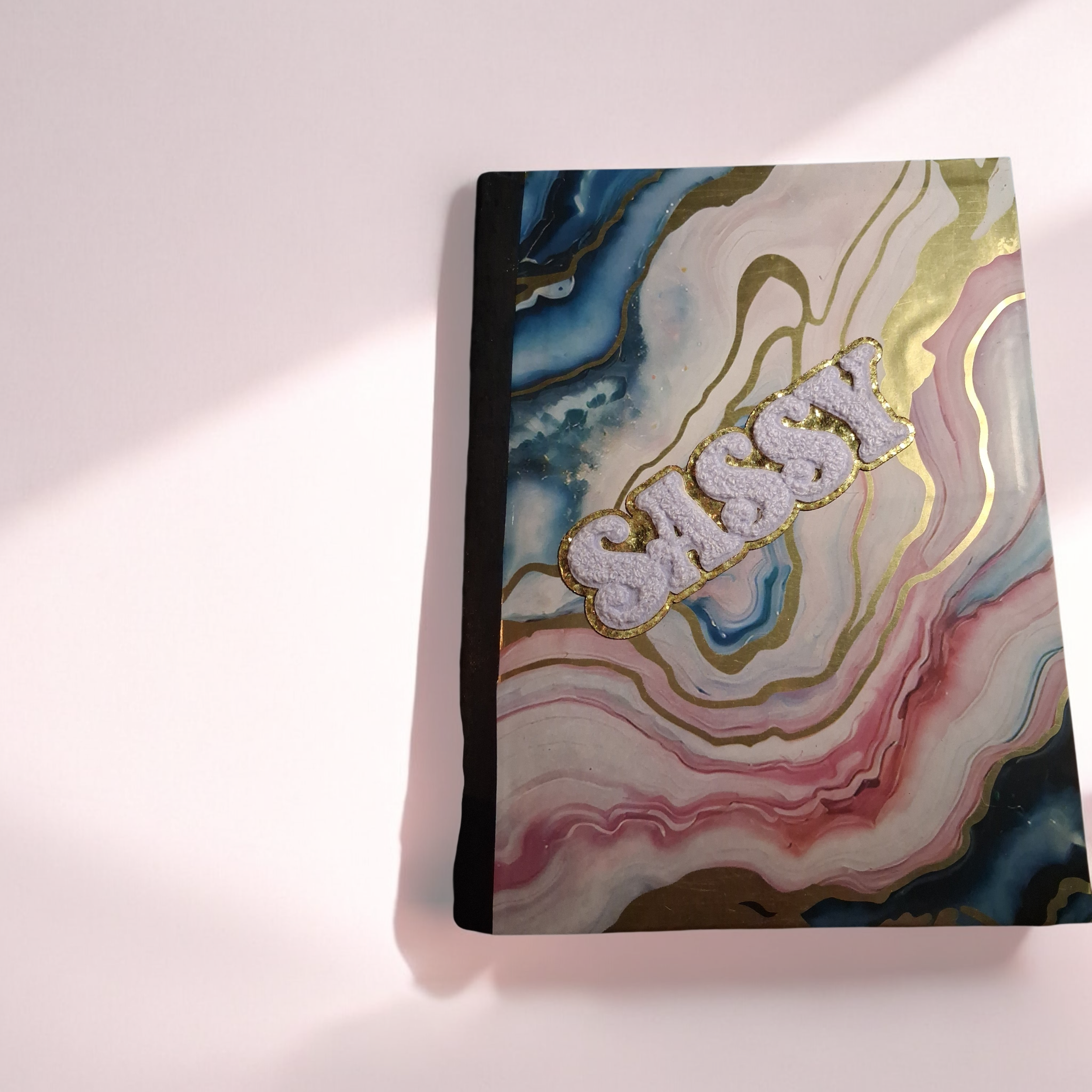 colorful composition book front.png
