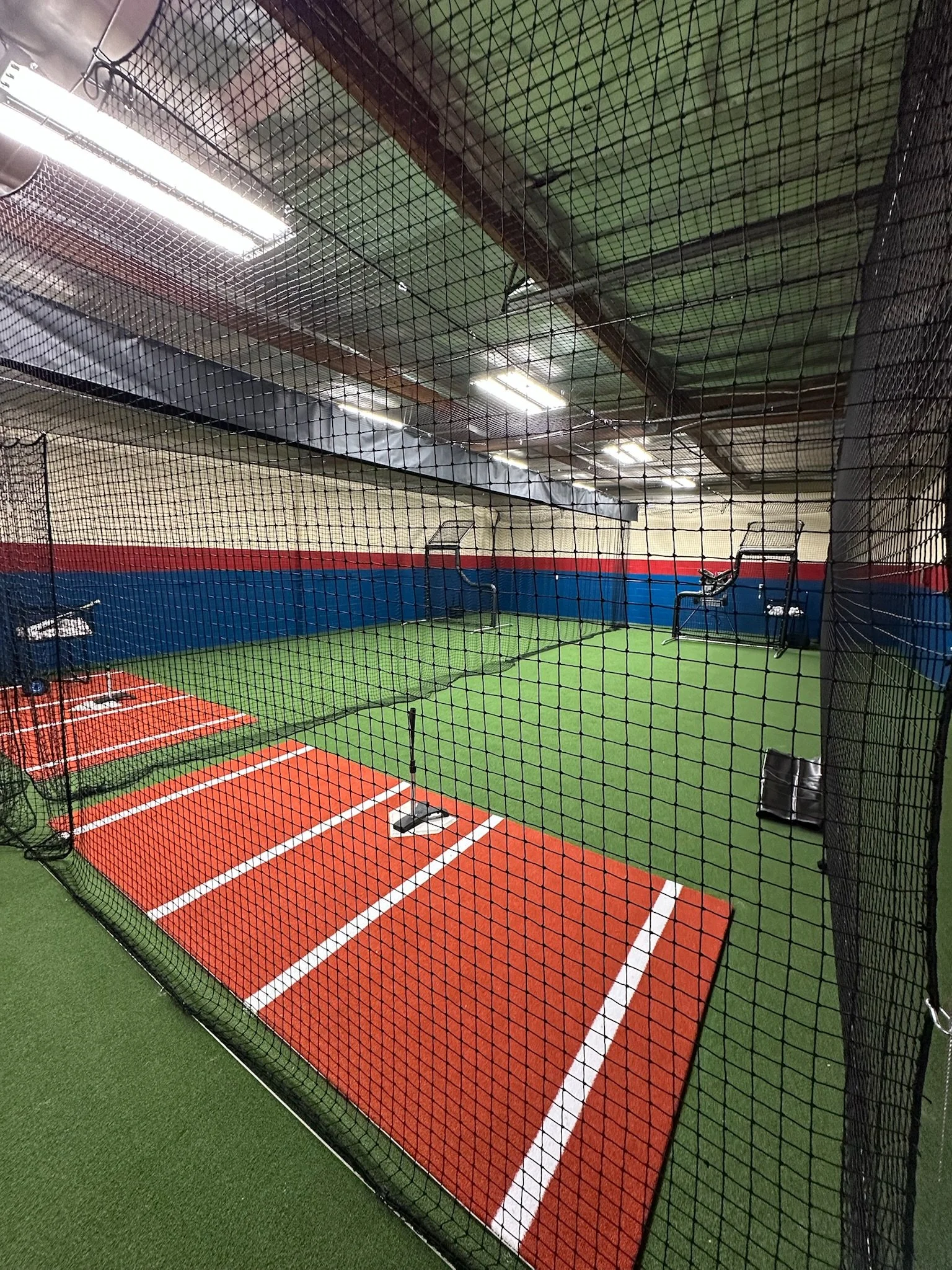 two 42 foot cages with a dividing net in the middle