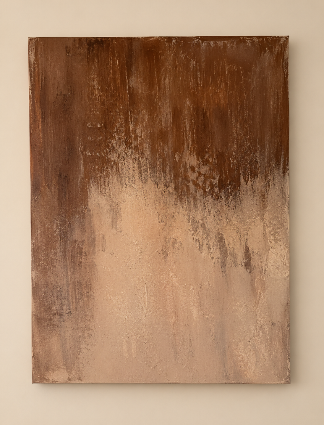 Where Earth Softens, a textural painting by Tatyana Russell with layered rust brown, warm beige, cream, and earthy mineral tones flowing across a weathered surface.