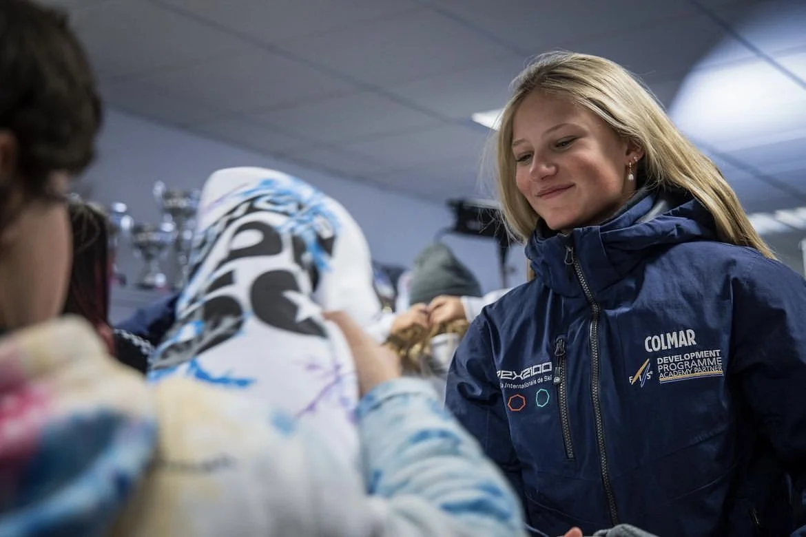Madi Gilson is receiving a gift from a race.