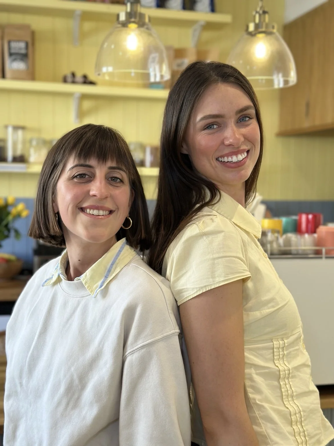 The owners of Choice coffee shop smiling together inside a brightly lit business premises, featured in Love, Blair's business content creation portfolio.