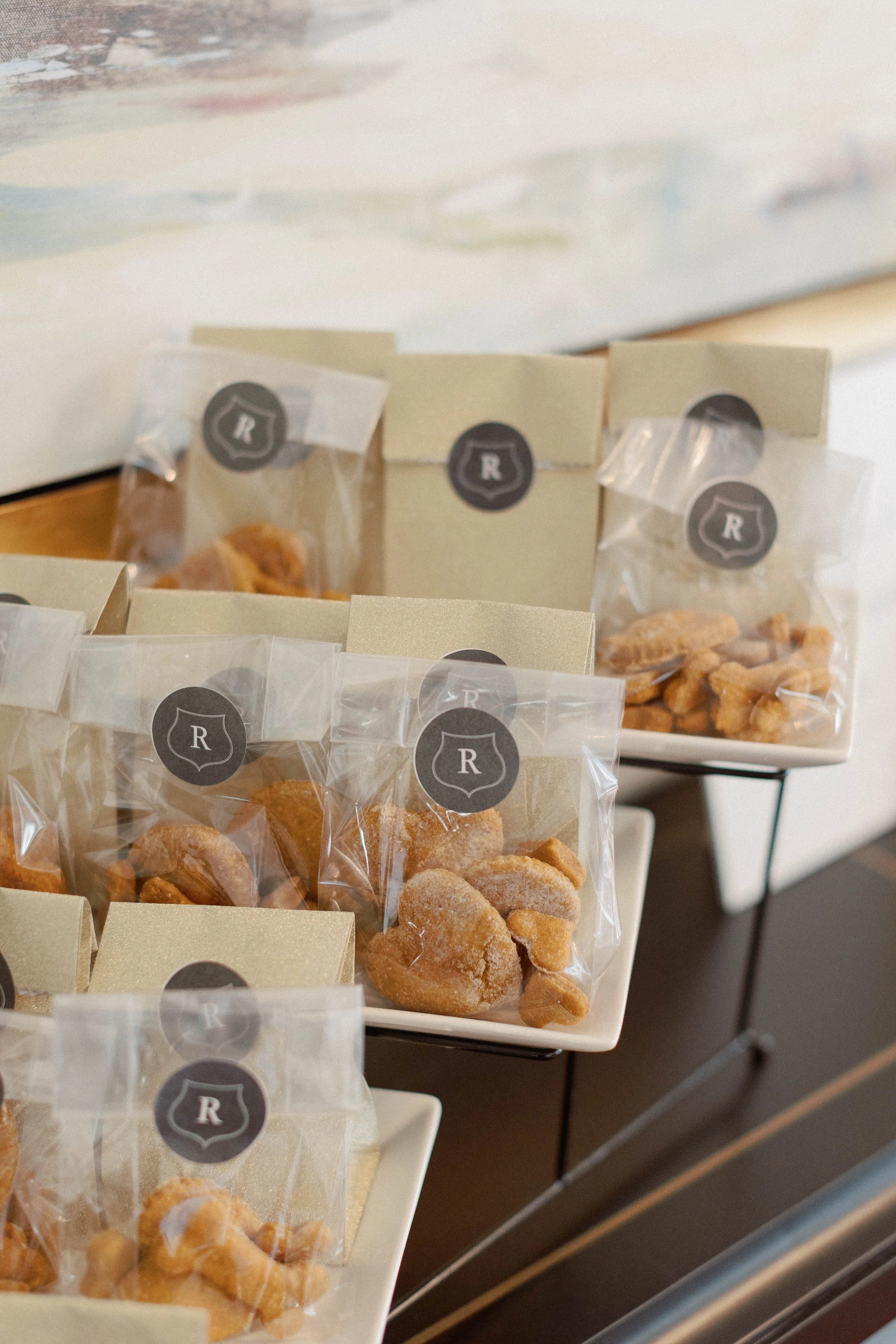 Various packaged dried fruits and nuts on a display table in a store.