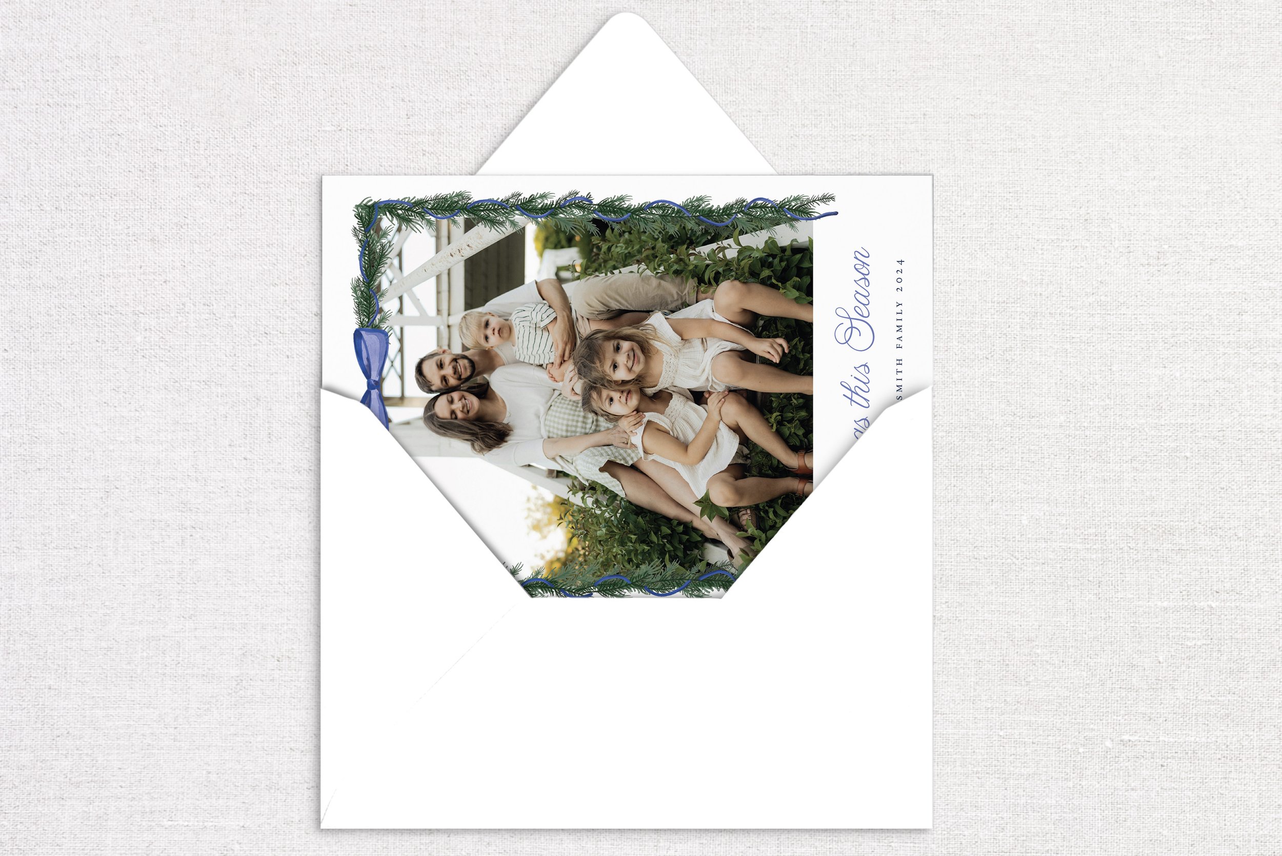 holiday-card-card-opening-blue-bow-garland.jpg