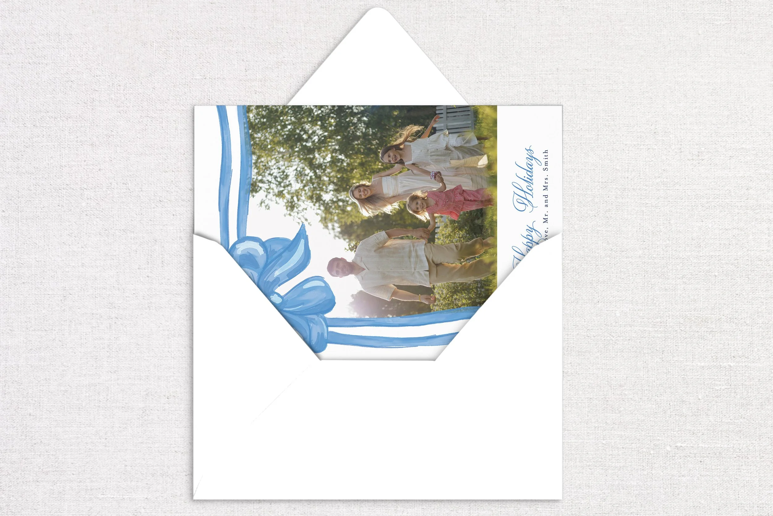 47holiday-card-card-opening-gift-bow-blue.jpg