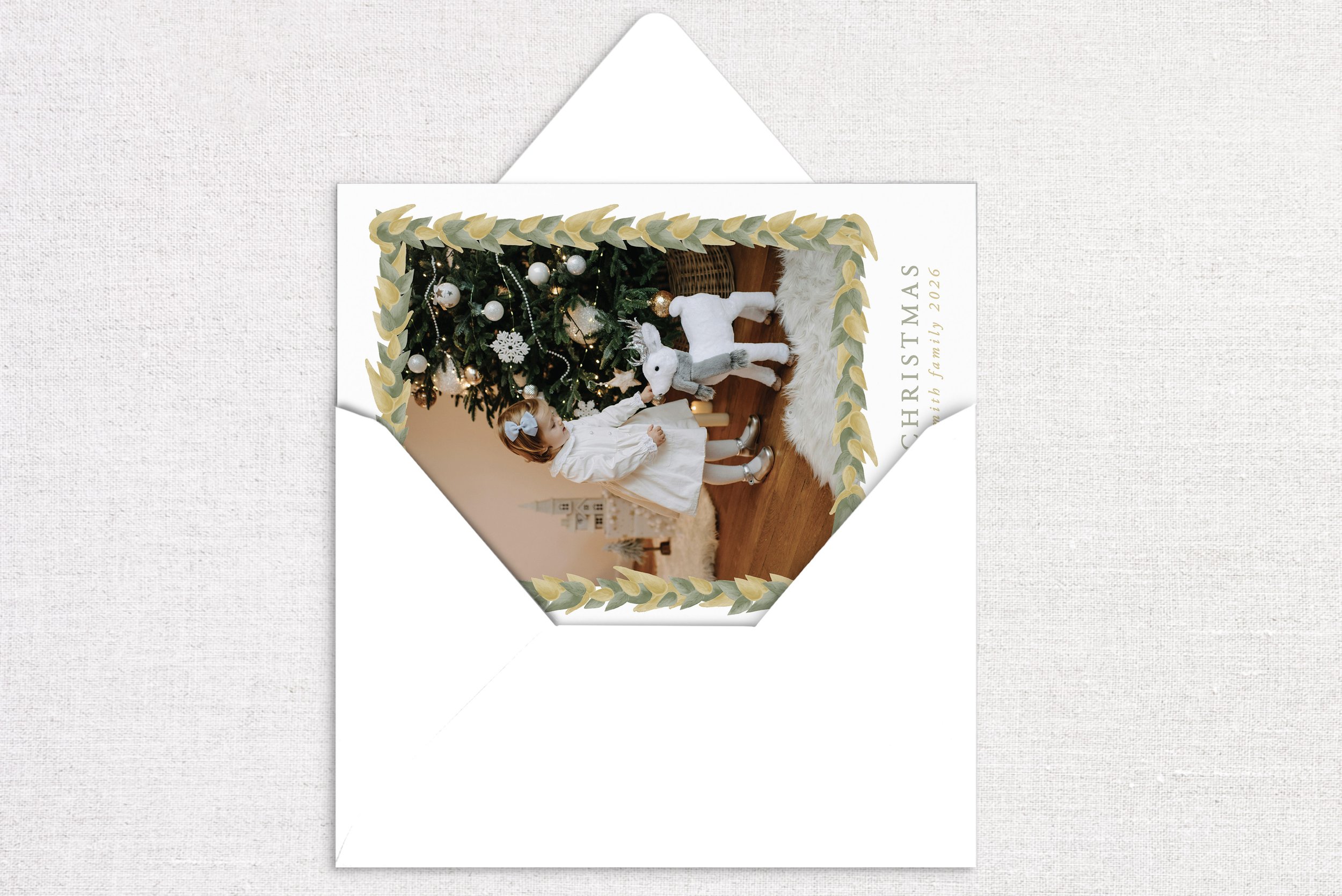 55holiday-card-card-opening-magnolia-leaf-garland.jpg