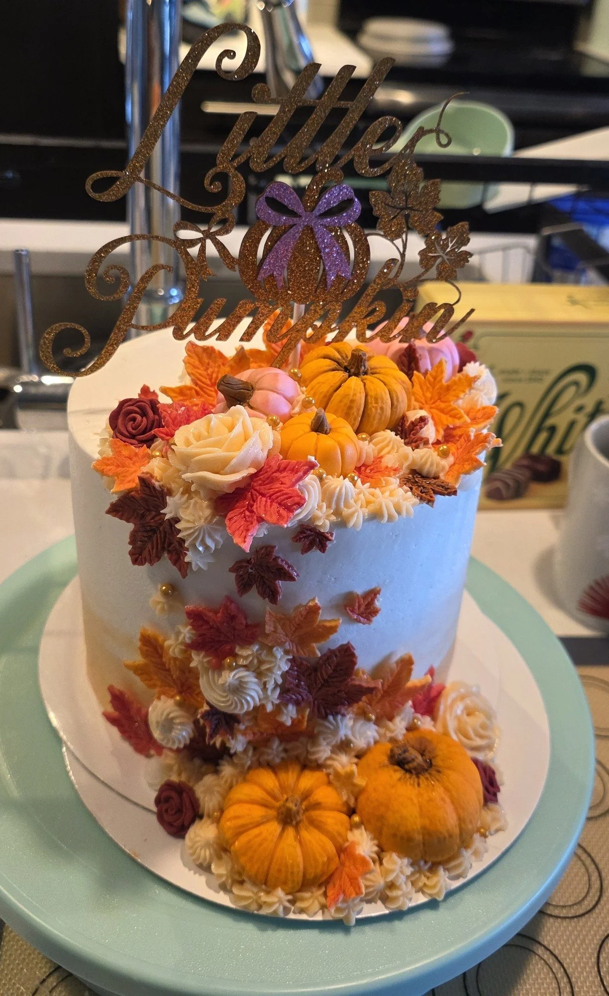 Jess’s autumn cake with tiny pumpkins, colorful leaves, and piped flowers.