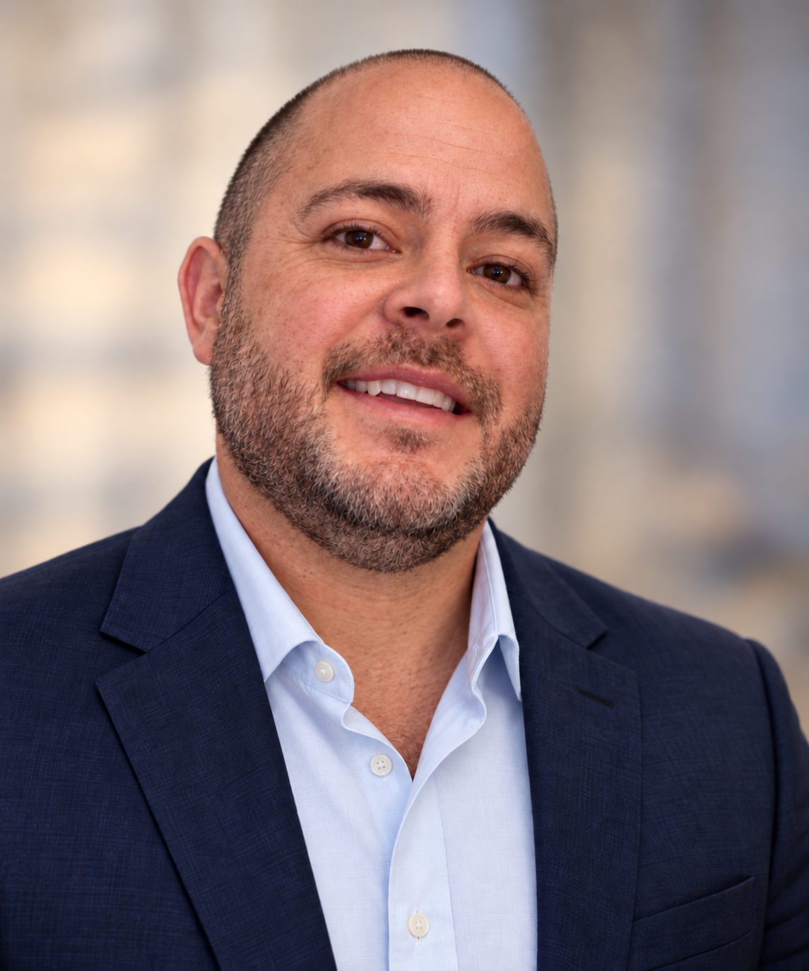 Matthew Gonzales, founder of Northstar Scholars, in a navy blazer and light blue shirt