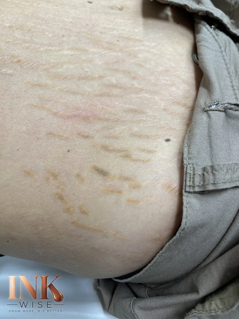 Stretch mark camouflage with oxidized ink turning orange and gray-green
