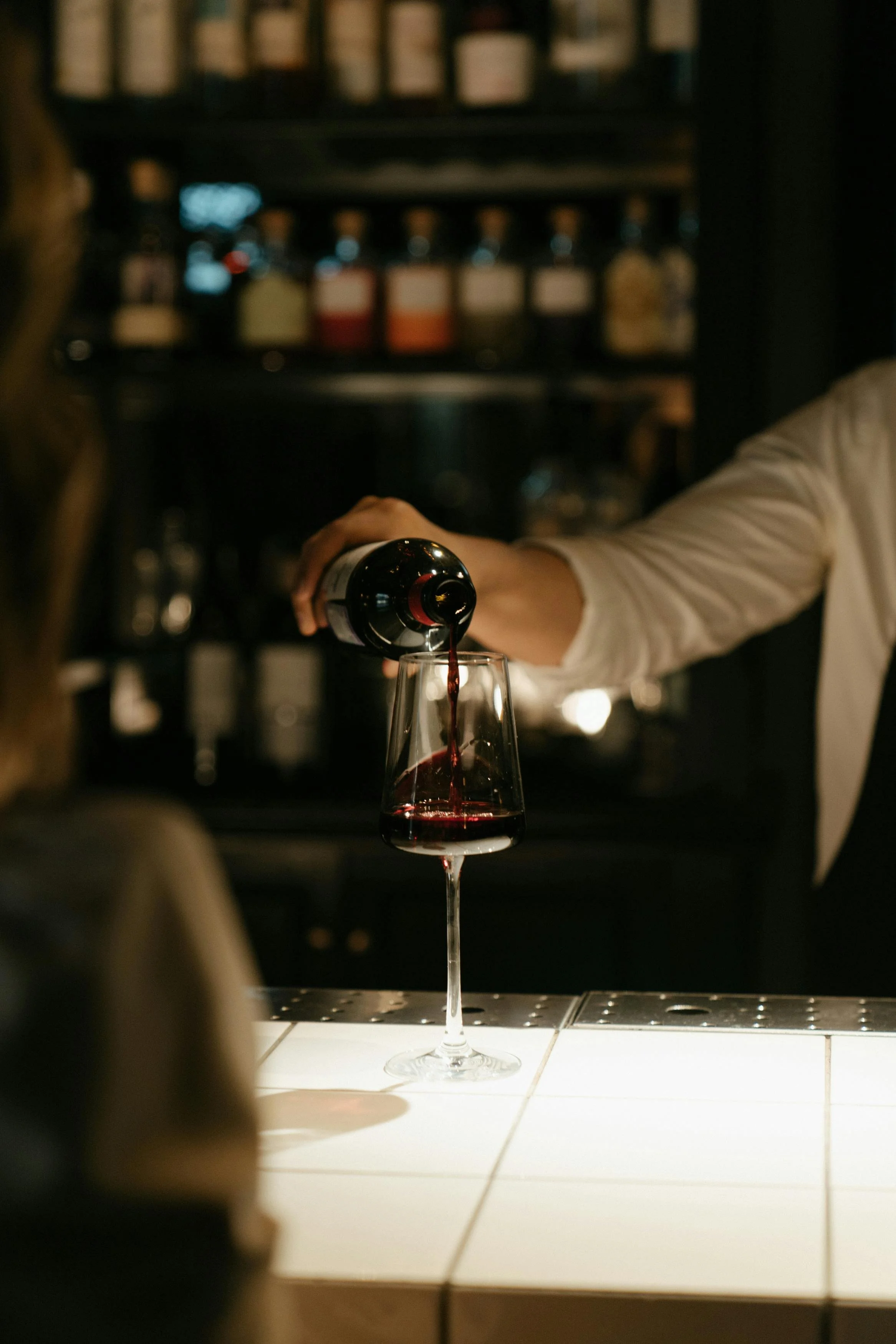 wine being poured into a wine glass