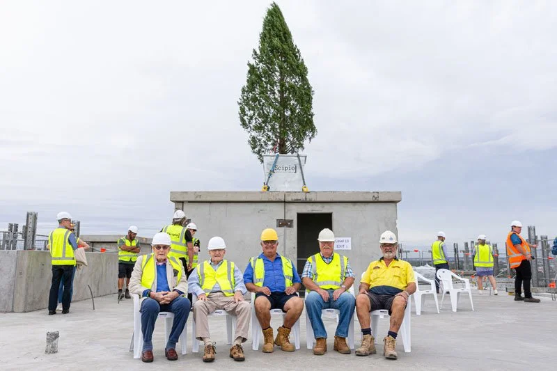 part of the no 1 team sitting in front of the tree top out