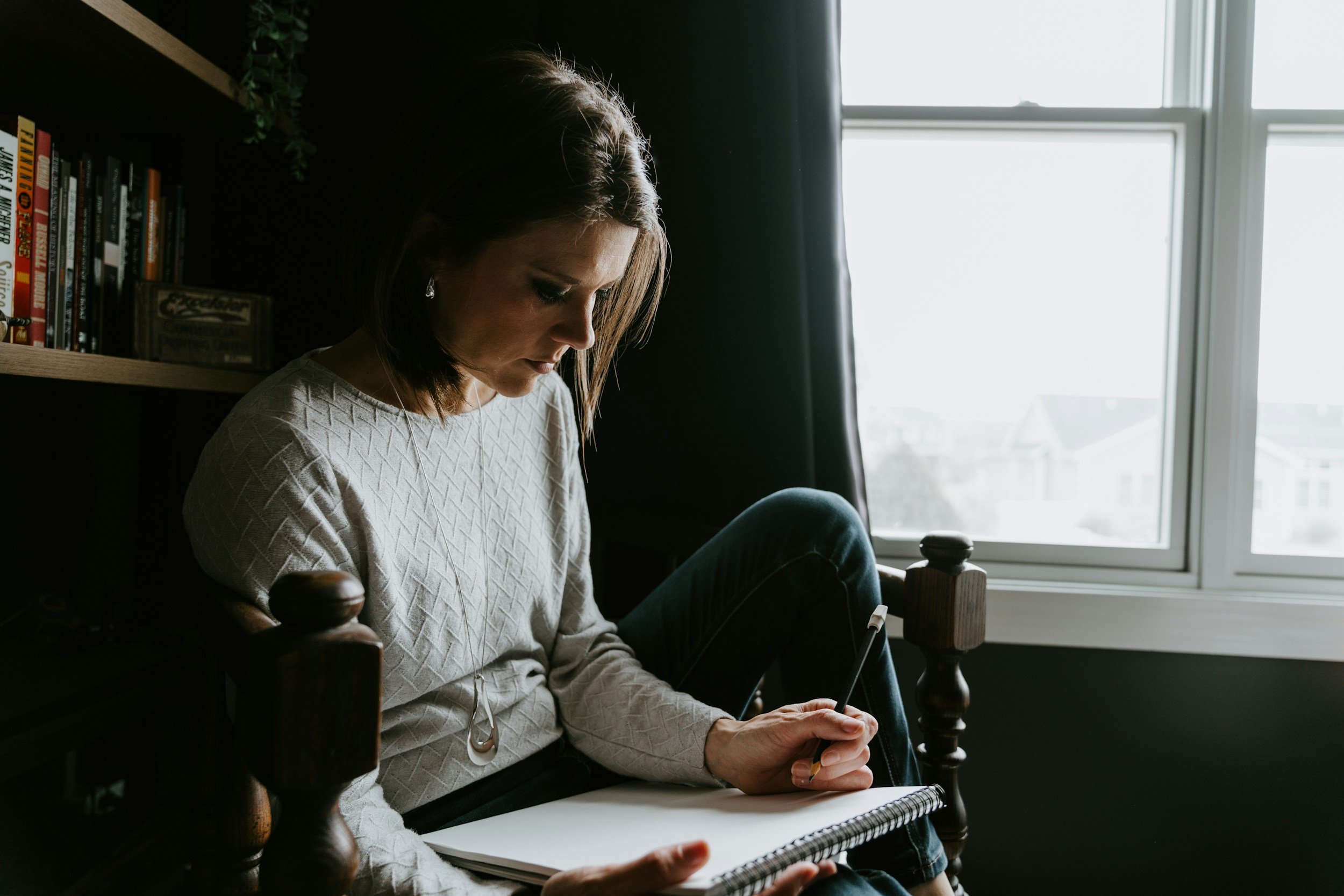 Patient writing down health goals before a first visit