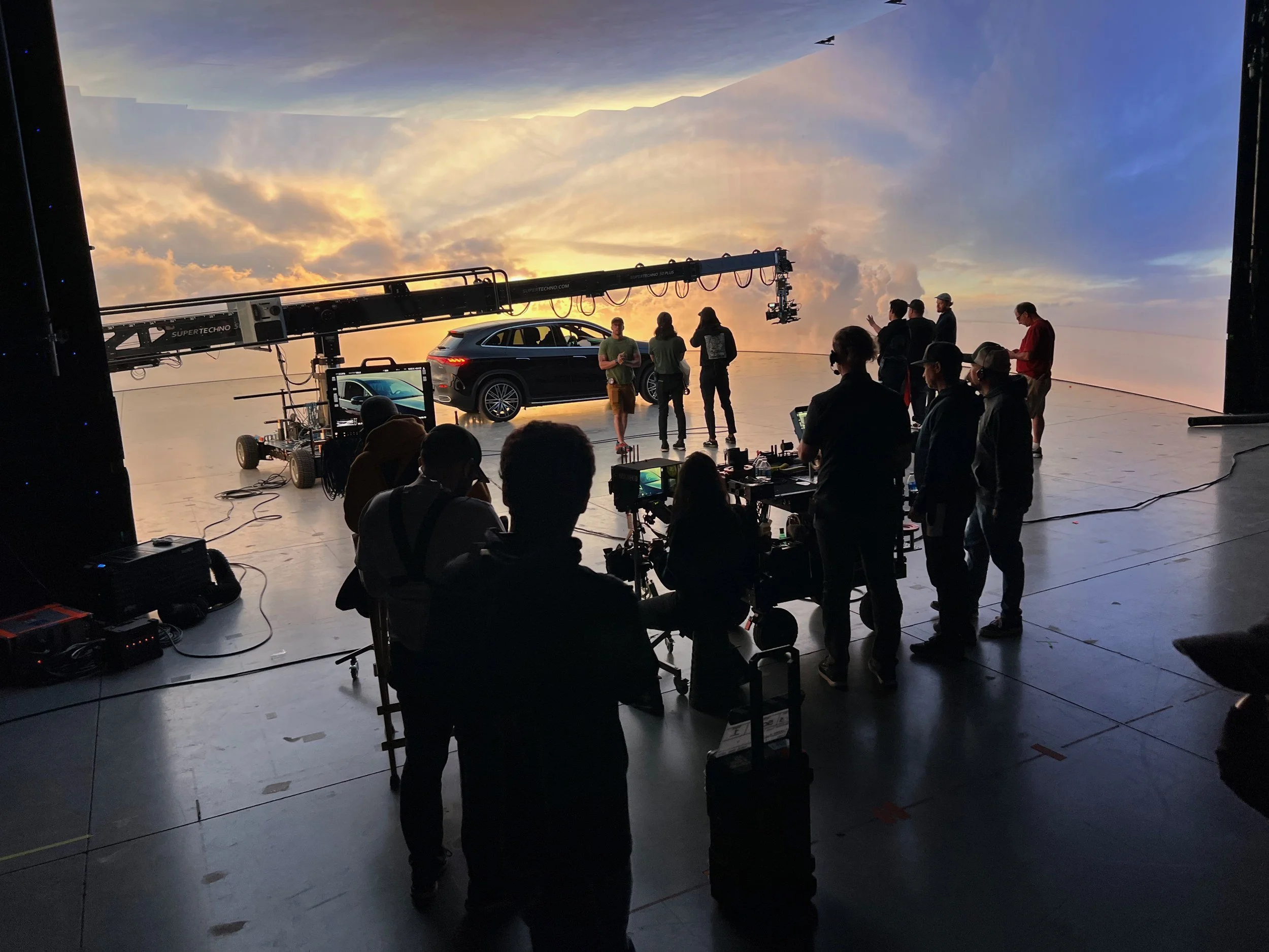 Crew watching playback on an LED volume stage