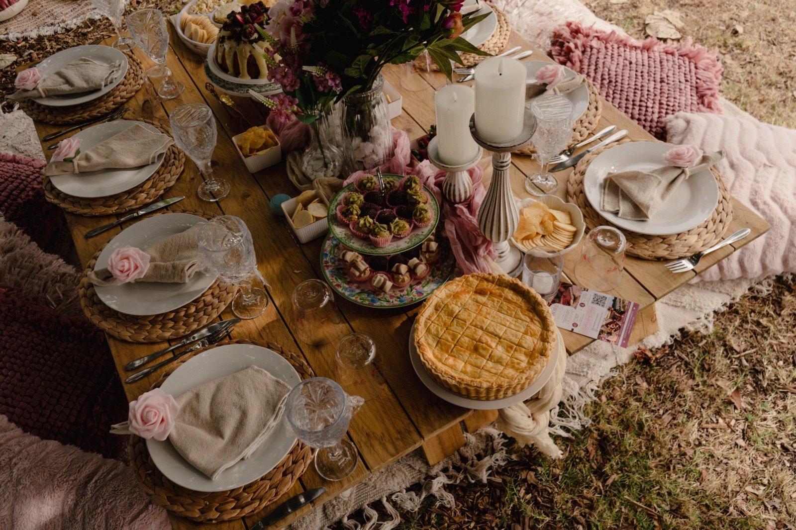 Overhead view of a picnic table with pie, desserts and place settings, Gold Coast