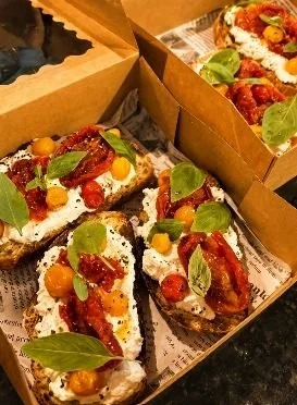 Bruschetta with ricotta and roasted tomatoes in catering boxes, Gold Coast