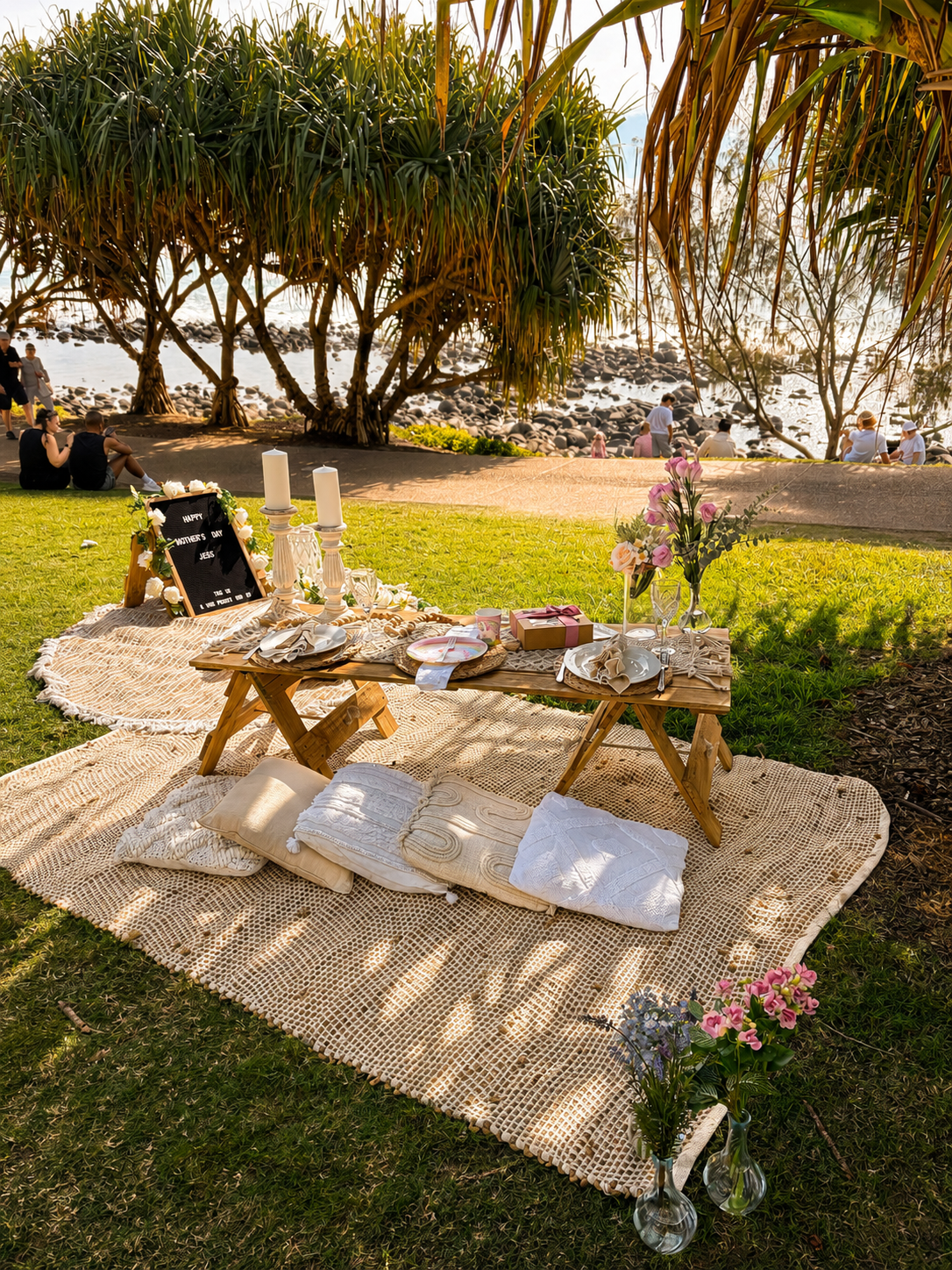 Pop-up picnic table with florals and crystal glassware, Gold Coast