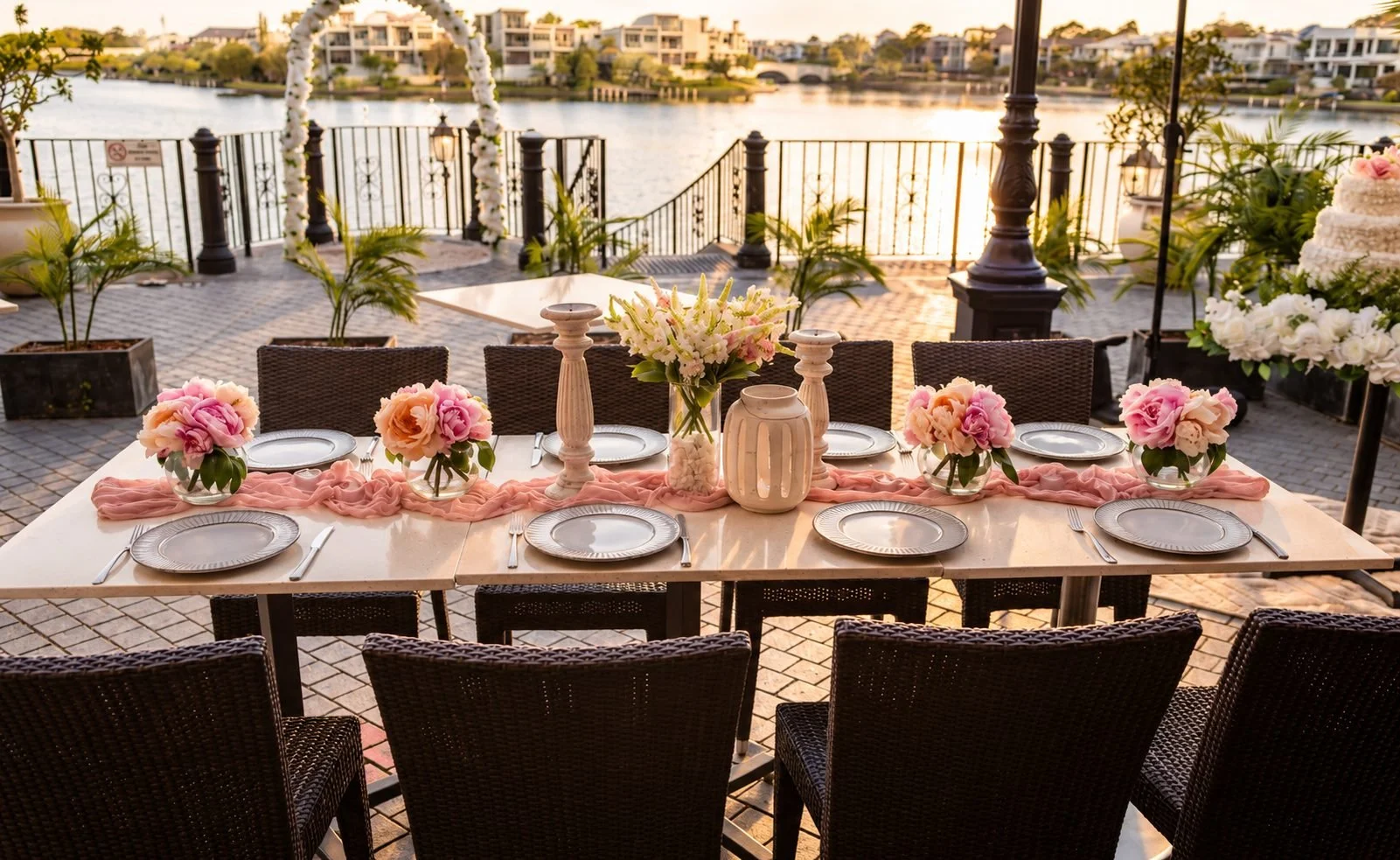 Lakeside long table event with pink florals, candles and sage napkins, Gold Coast