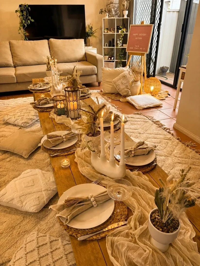 Indoor picnic in a living room with cushions, candles and a low table, Gold Coast