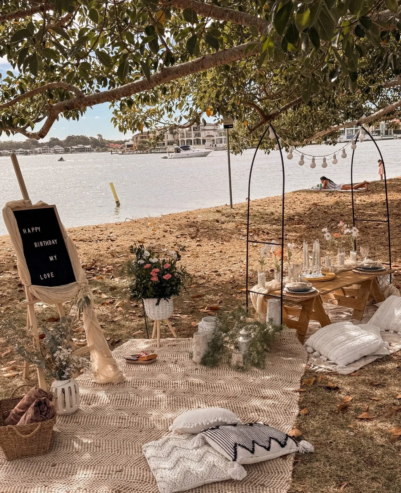 Beachside pop-up picnic with arches, cushions and a letter board sign, Gold Coast