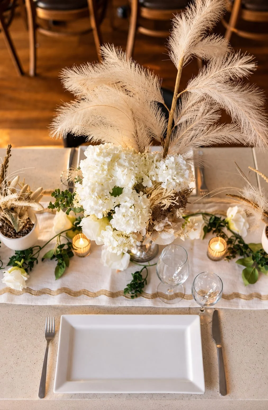 Pampas grass and white flower centrepiece on an event table, Gold Coast