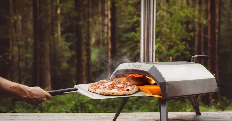 Ooni Karu is Scottish company Ooni’s latest portable wood & charcoal-fired pizza oven. Reaches 932°F (500°C). Features ceramic fiber-insulated stainless steel body, extra-thick stone baking board and patented Flame Keeper technology.