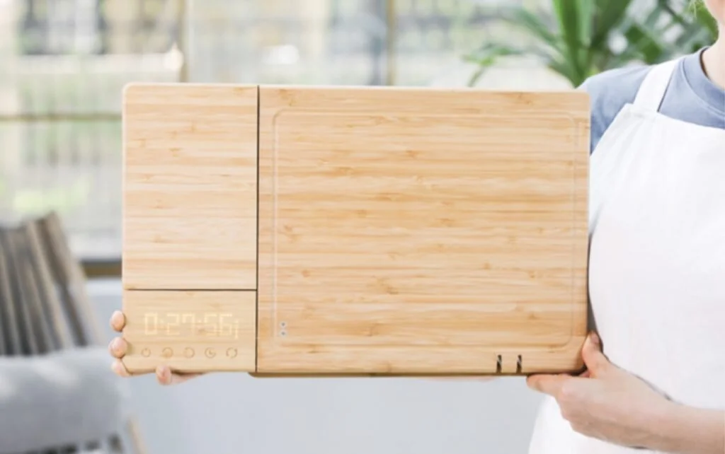 The ChopBox is made out of natural bamboo and is 100% recyclable with replaceable parts. It consists of 2 chopping boards with inbuilt knife sharpeners, a scale, timer, knife sanitiser and is waterproof.